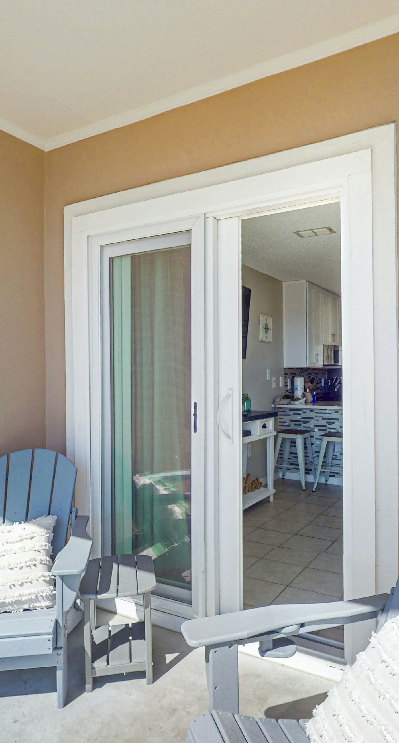 Beachfront condo with pool, private balcony, and washer and dryer