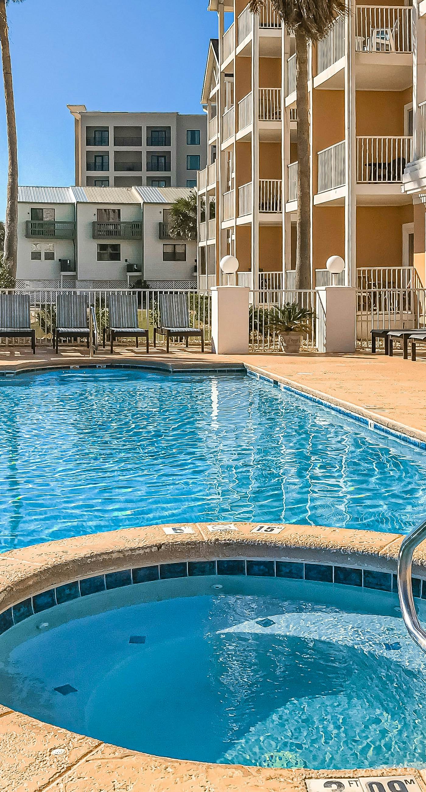 Beachfront condo with pool, private balcony, and washer and dryer