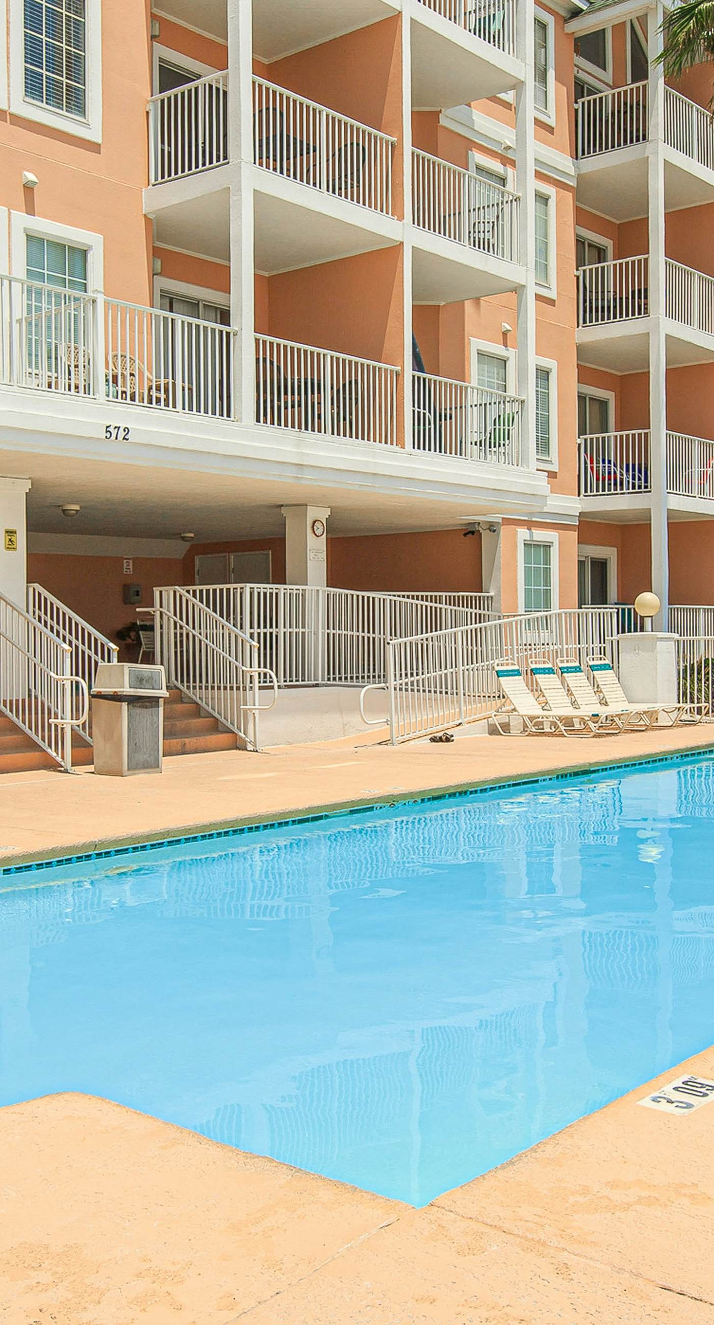 Beachfront condo with pool, private balcony, and washer and dryer