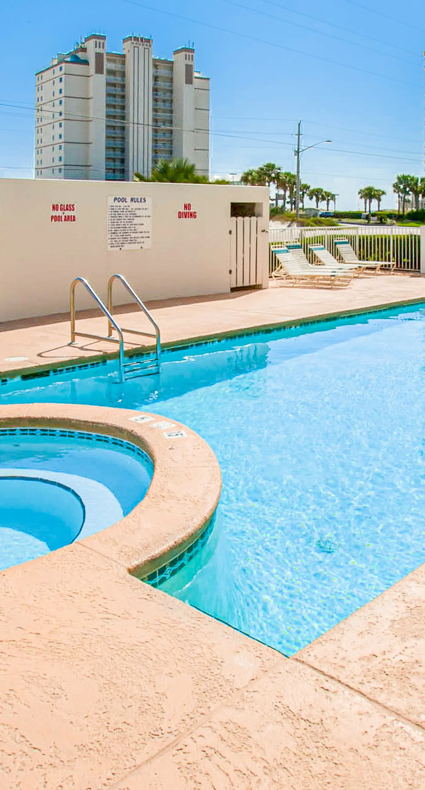 Beachfront condo with pool, private balcony, and washer and dryer