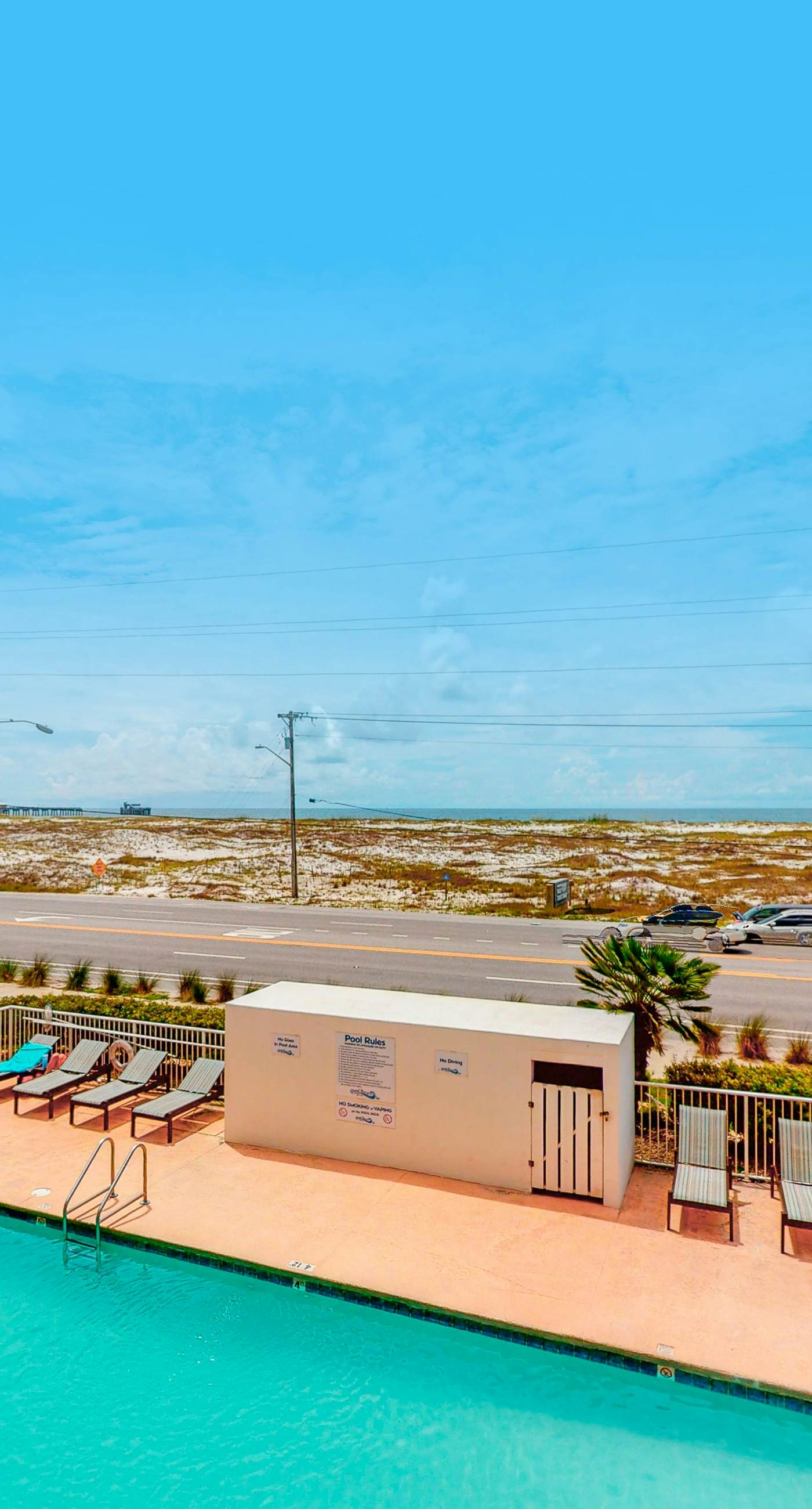 Beachfront condo with pool, private balcony, and washer and dryer