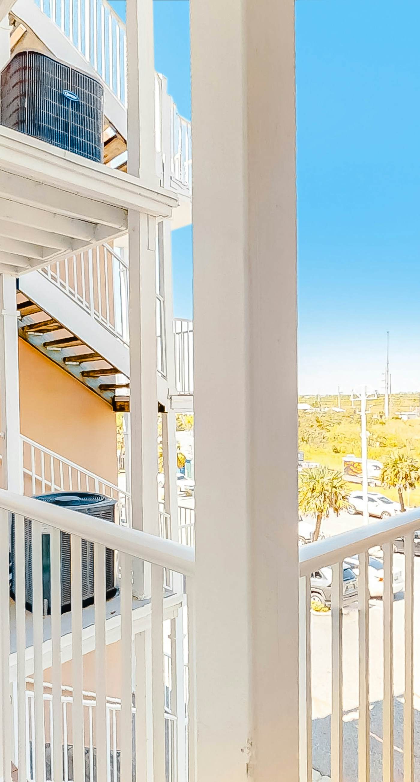 Beachfront condo with pool, private balcony, and washer and dryer