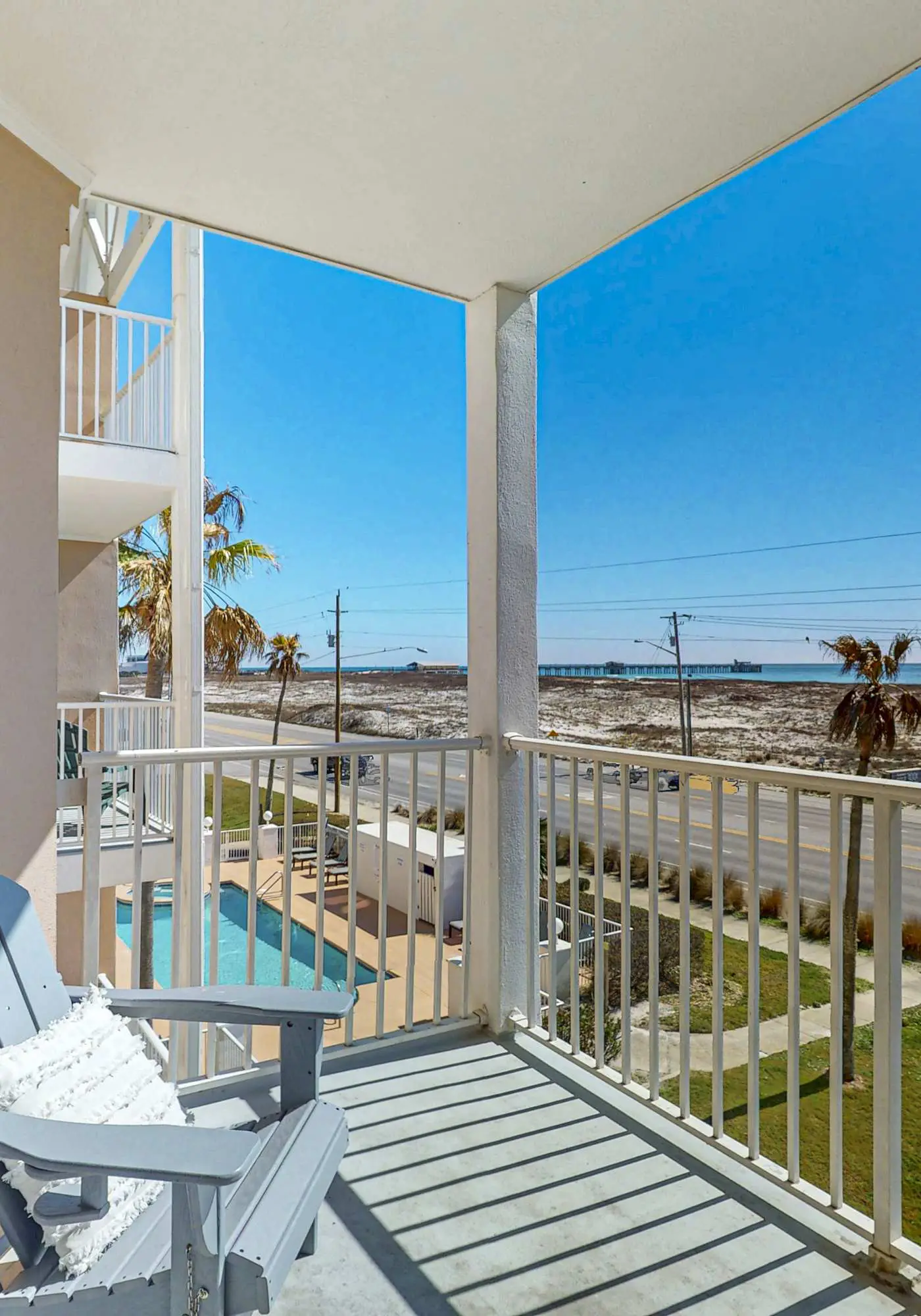 Beachfront condo with pool, private balcony, and washer and dryer