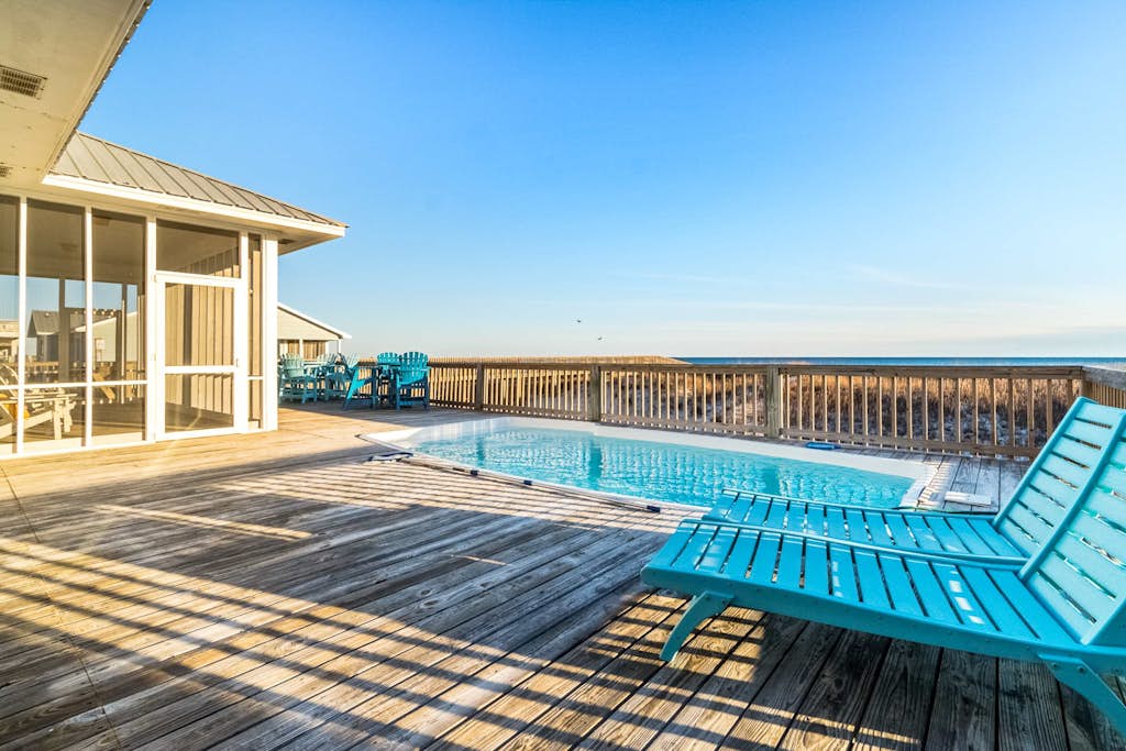 Beachfront retreat with private pool, wraparound deck & screened-in porch