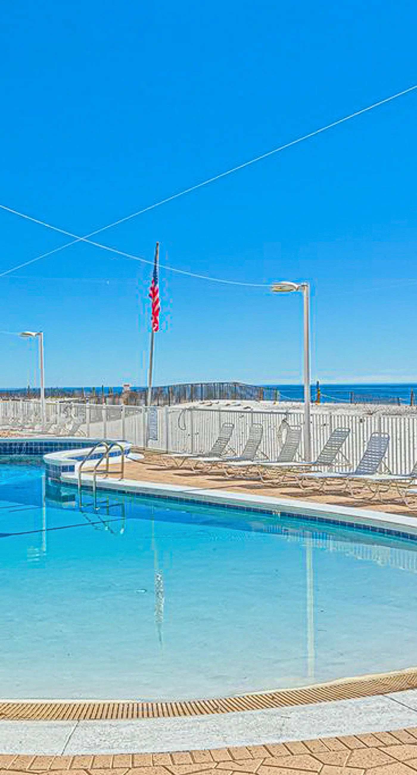 Beachfront condo with private balcony, outdoor pool, direct beach access & views