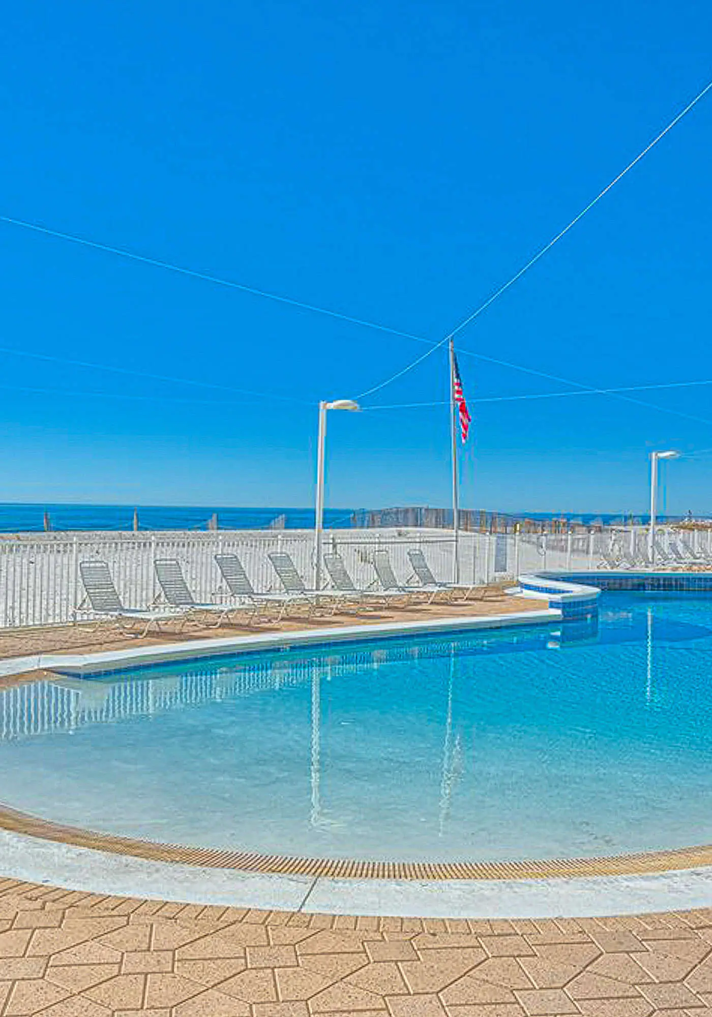 Beachfront condo with private balcony, outdoor pool, direct beach access & views