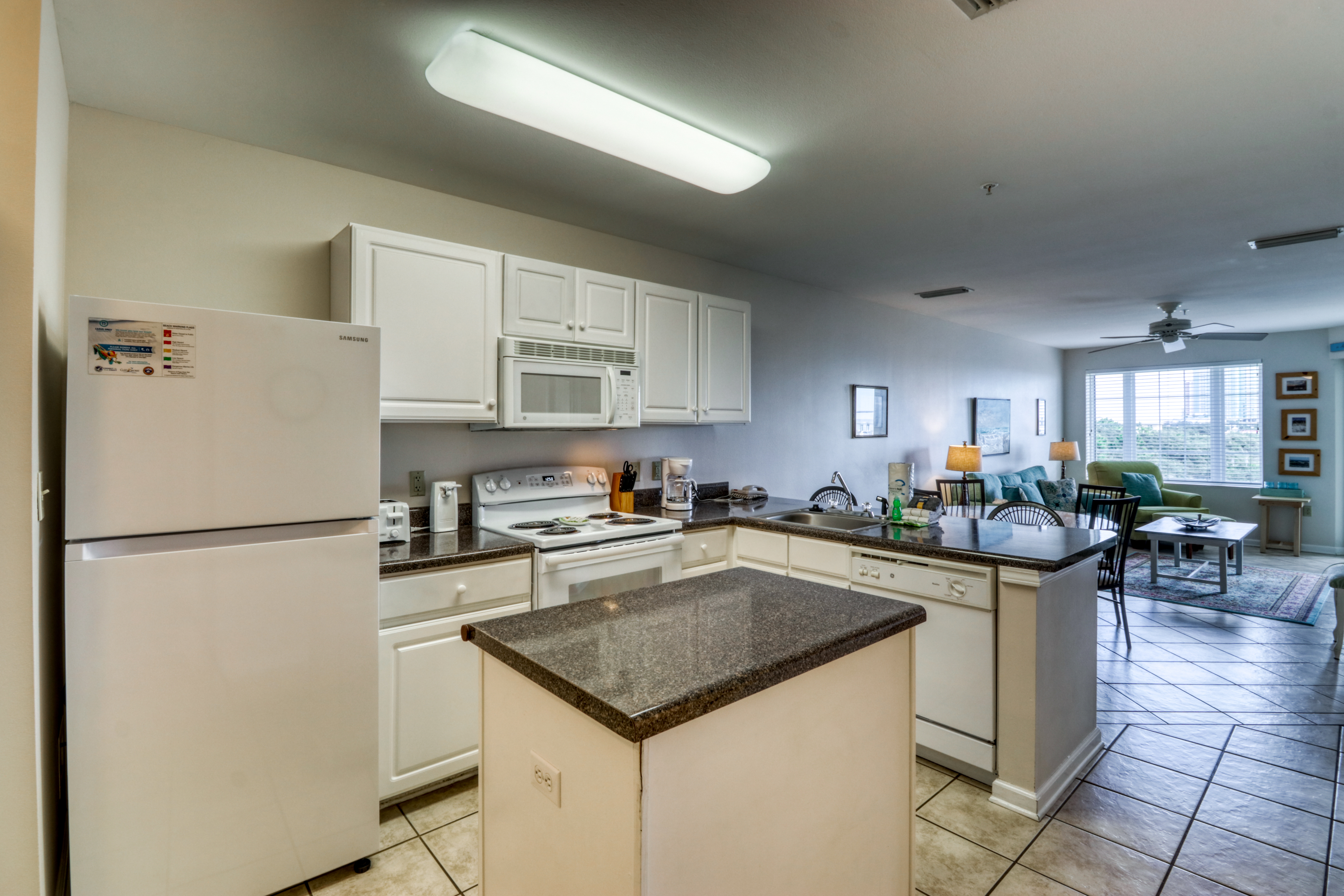 Second floor condo with Gulf view, shared pool, central AC, & BBQ area