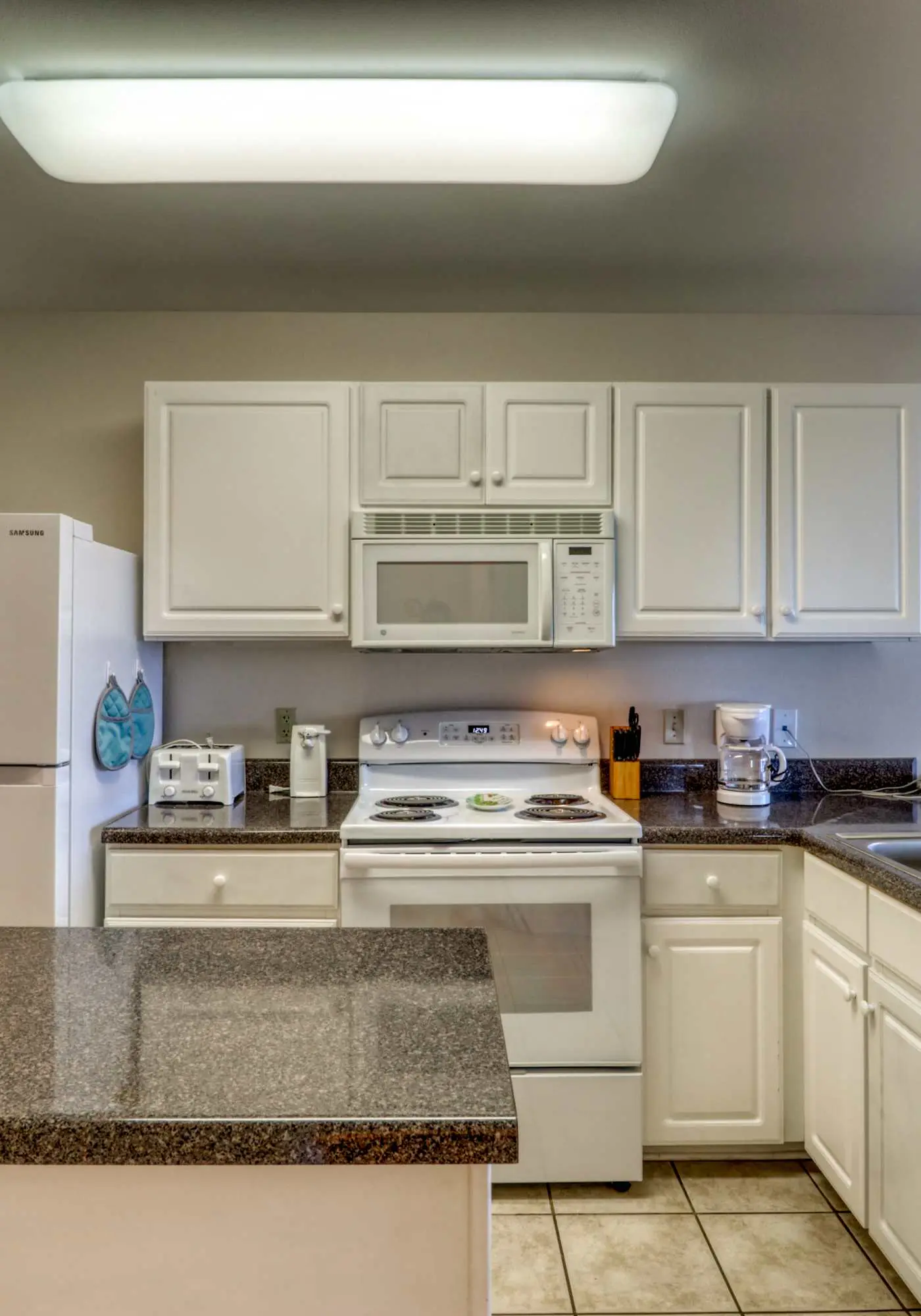 Second floor condo with Gulf view, shared pool, central AC, & BBQ area