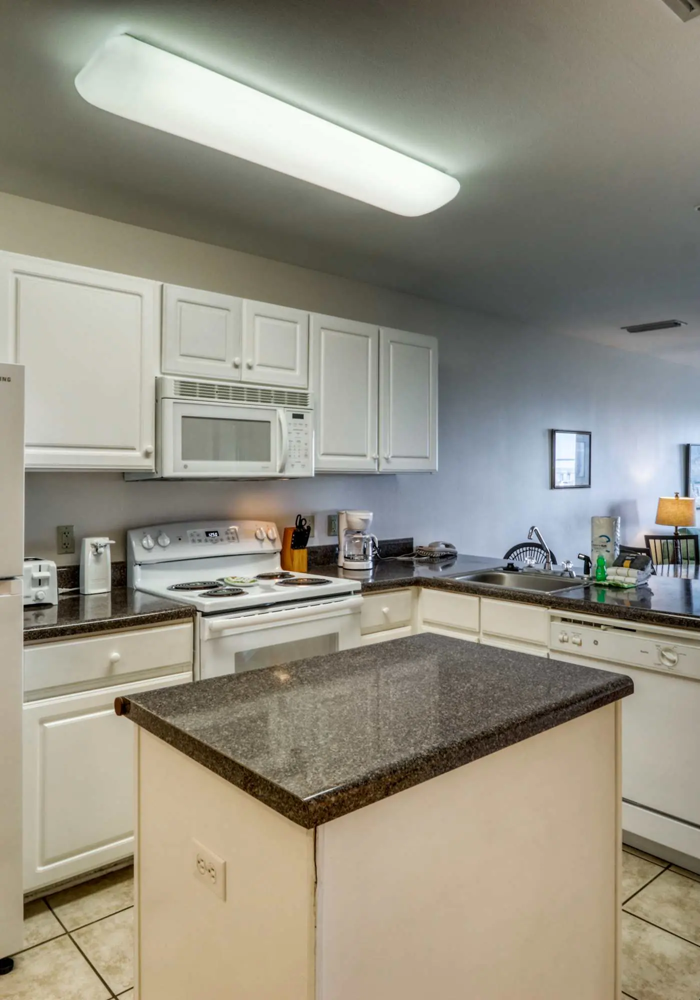 Second floor condo with Gulf view, shared pool, central AC, & BBQ area