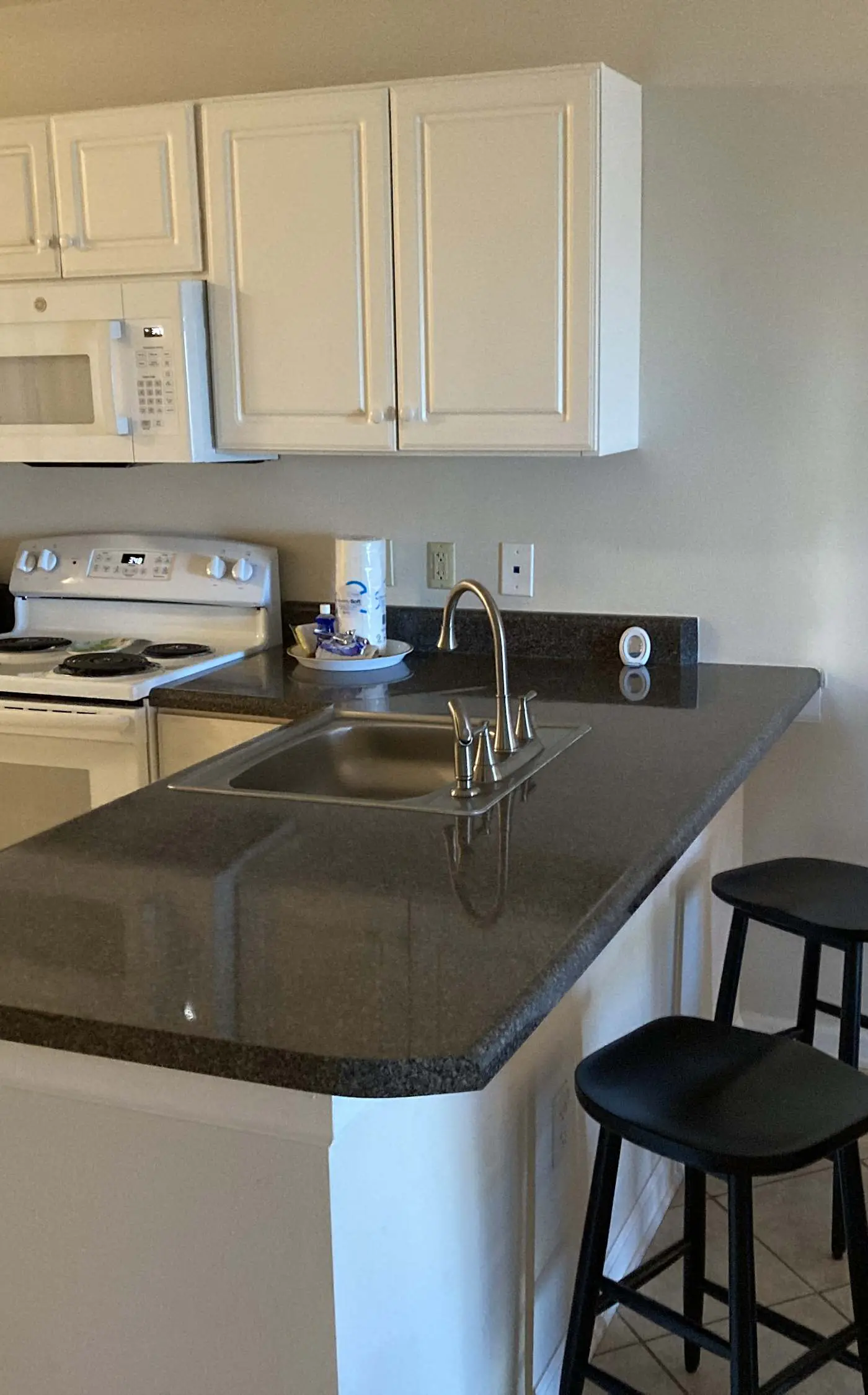 Second floor condo with Gulf view, shared pool, central AC, & BBQ area