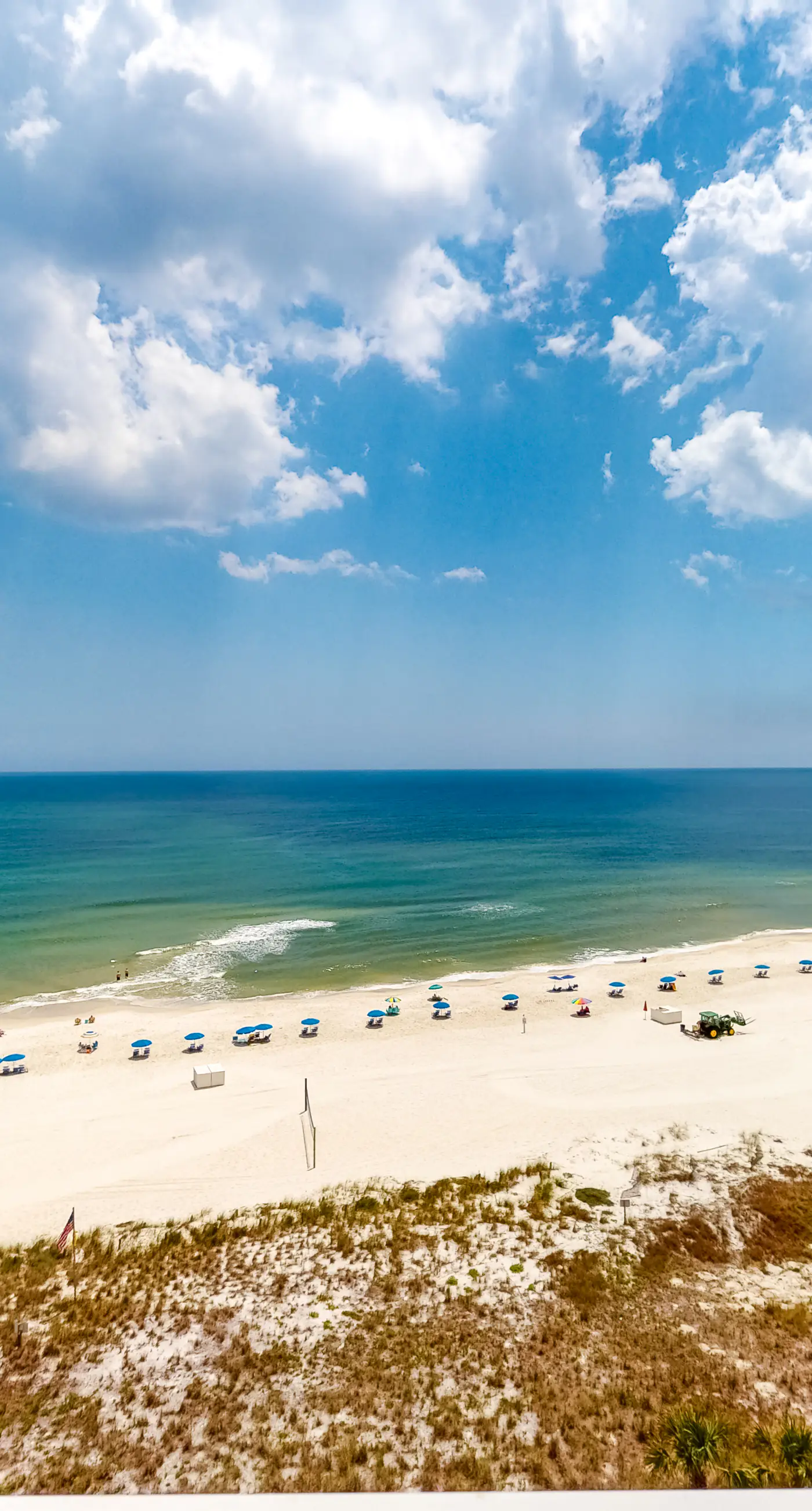 Large beachfront condo with views from private balcony and shared hot tub & pool