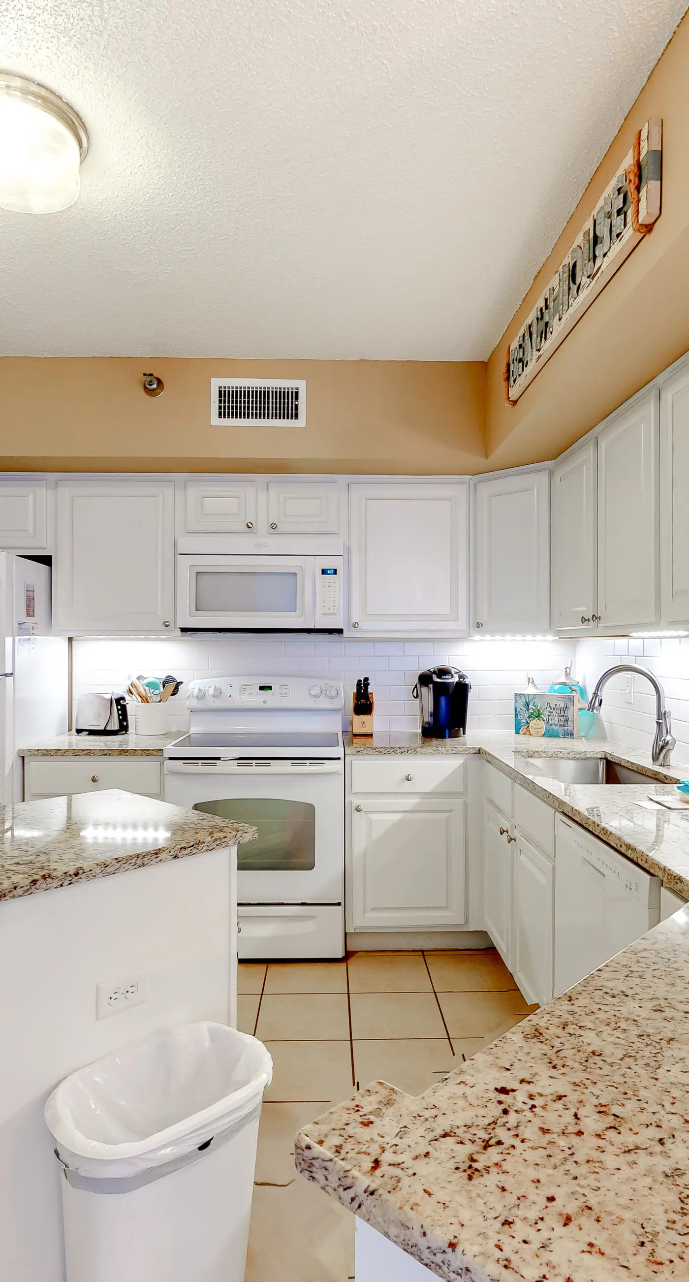 Large beachfront condo with views from private balcony and shared hot tub & pool