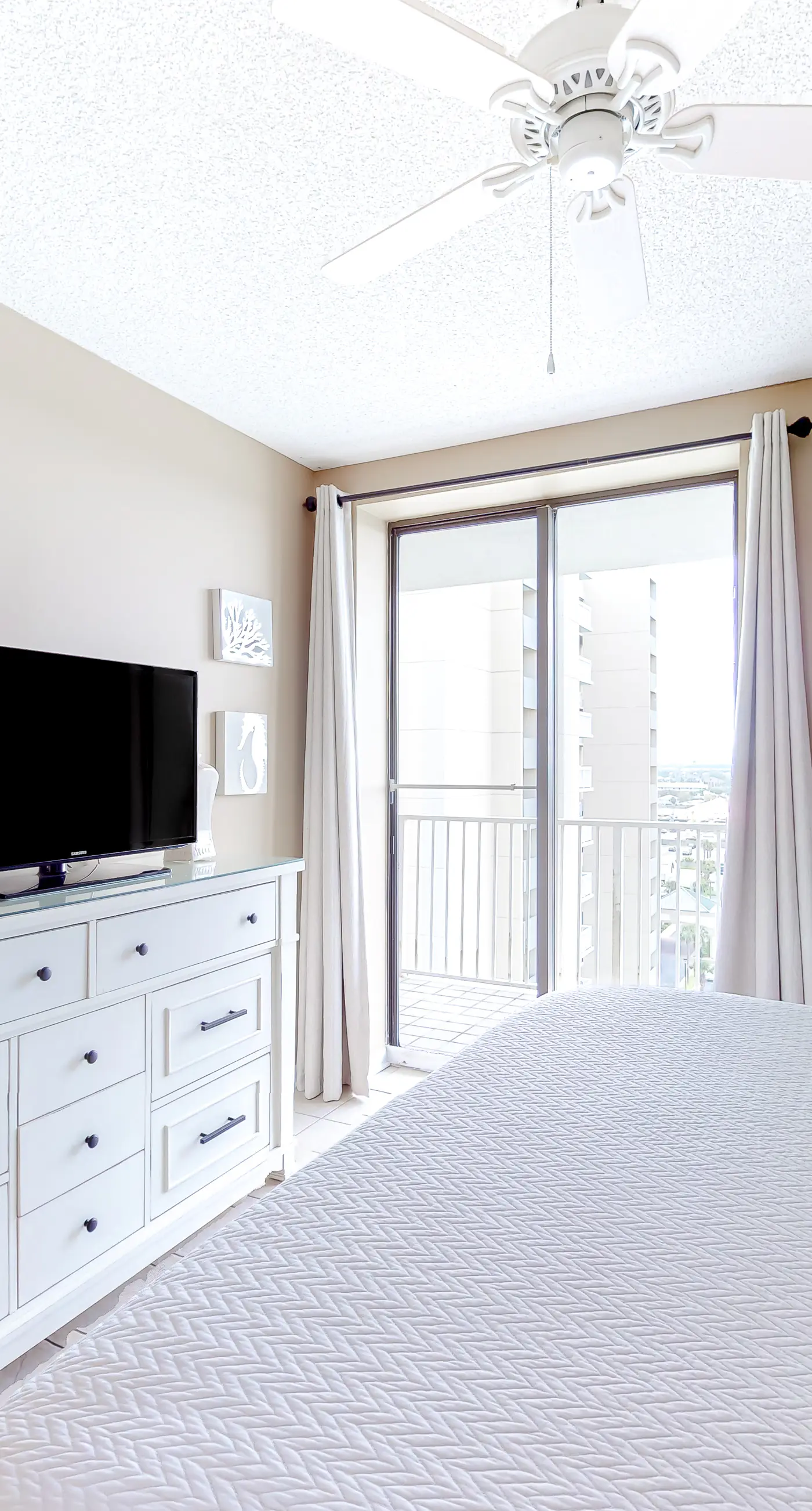 Large beachfront condo with views from private balcony and shared hot tub & pool