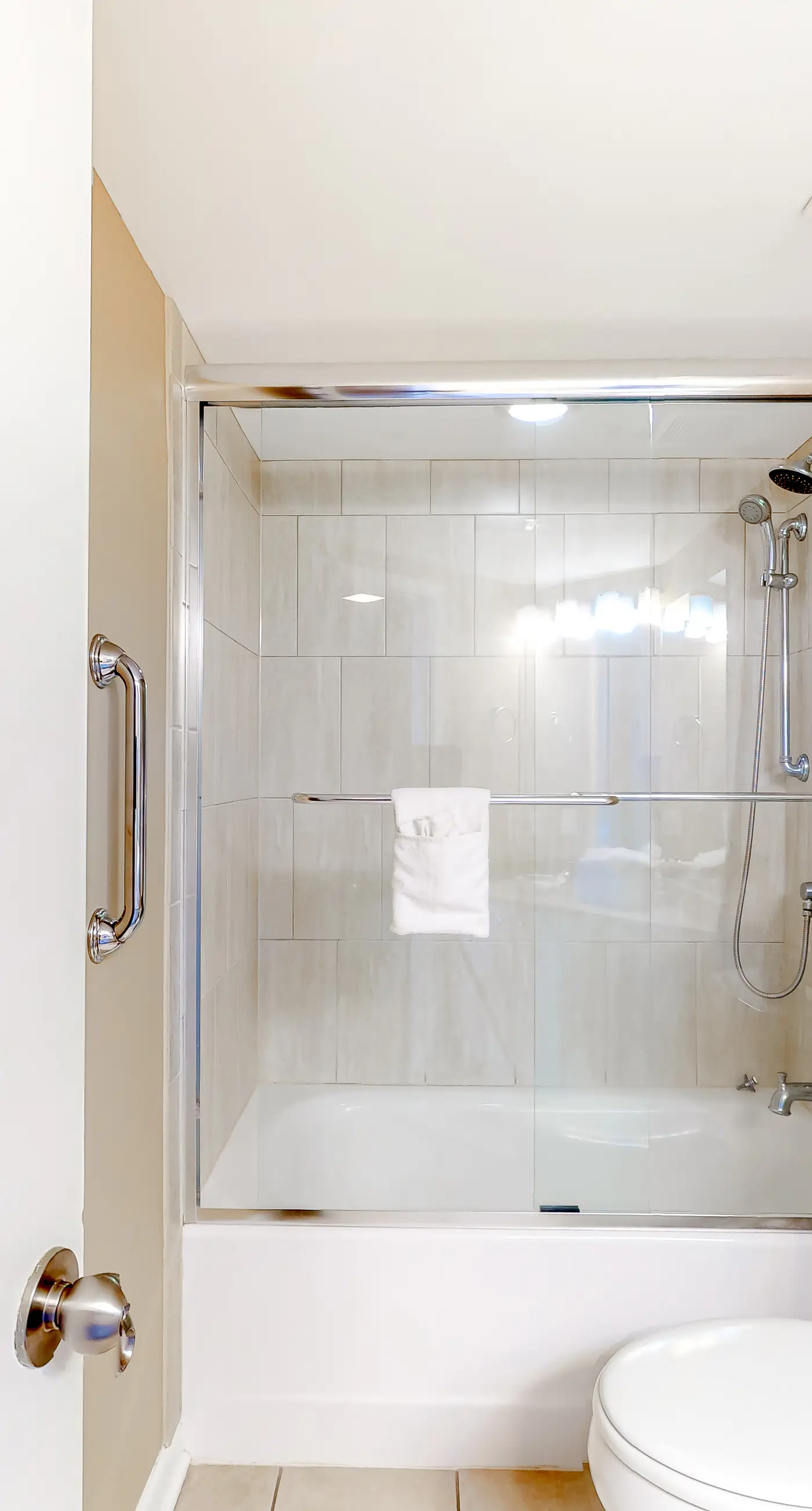 Large beachfront condo with views from private balcony and shared hot tub & pool