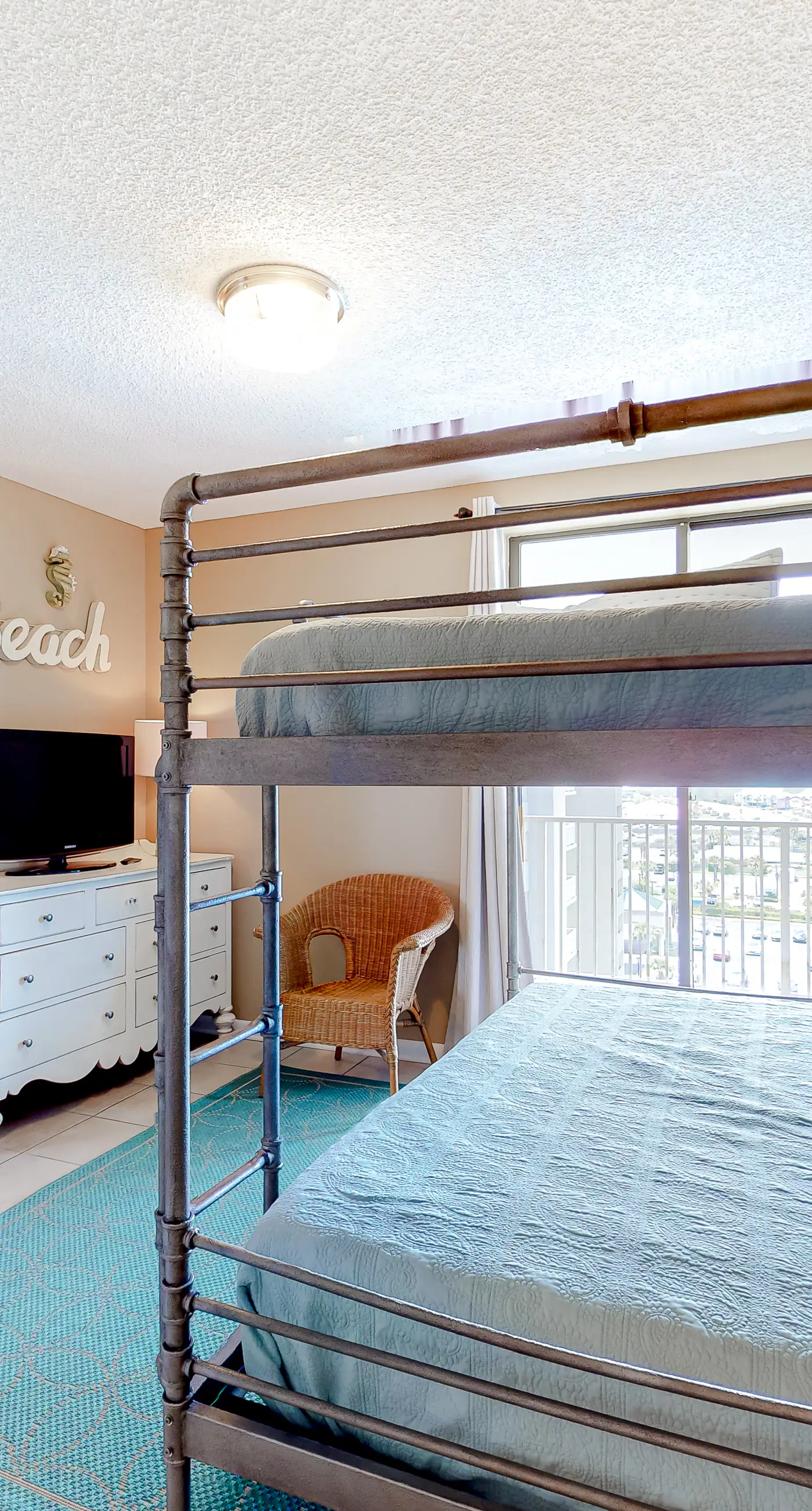 Large beachfront condo with views from private balcony and shared hot tub & pool