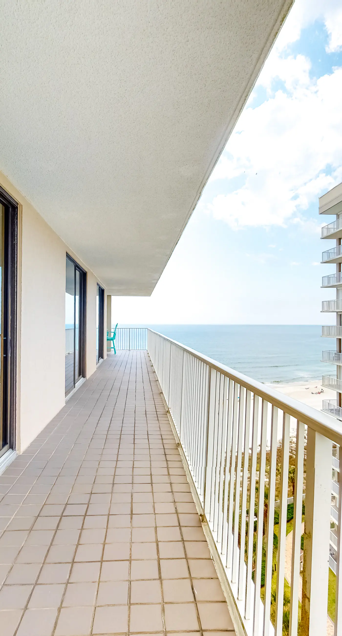 Large beachfront condo with views from private balcony and shared hot tub & pool