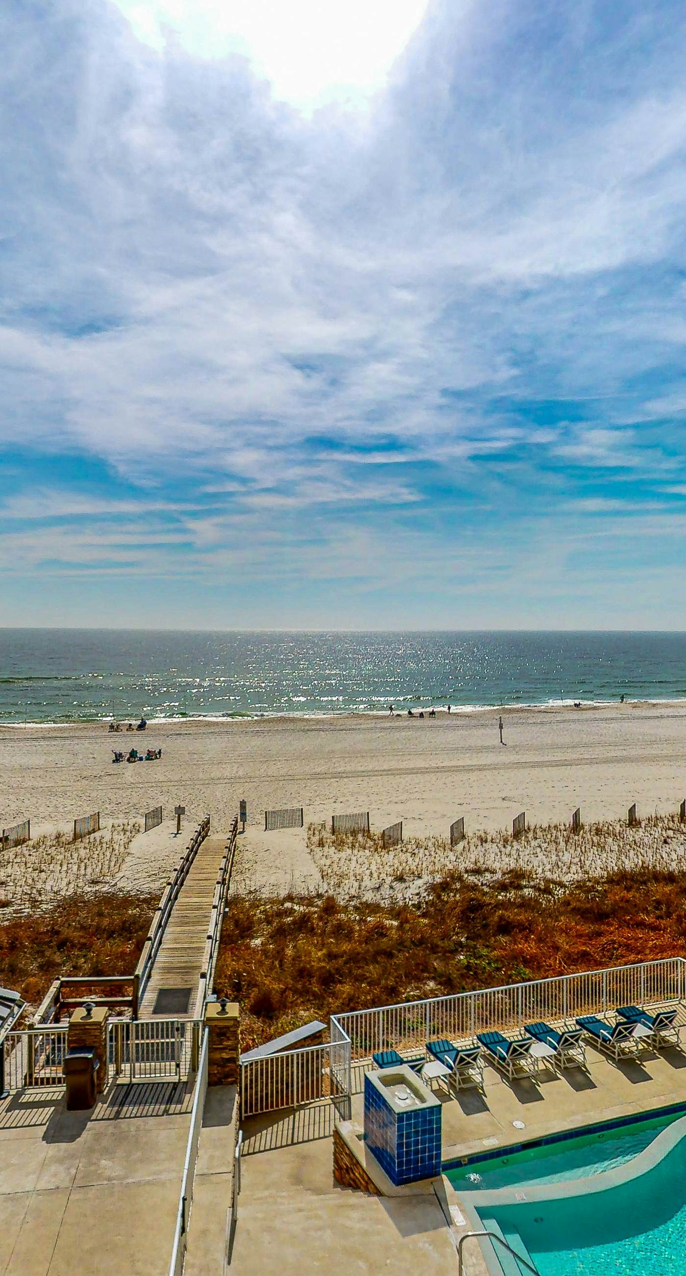 Spacious condo with Gulf-front views & access to pools, hot tub, gym