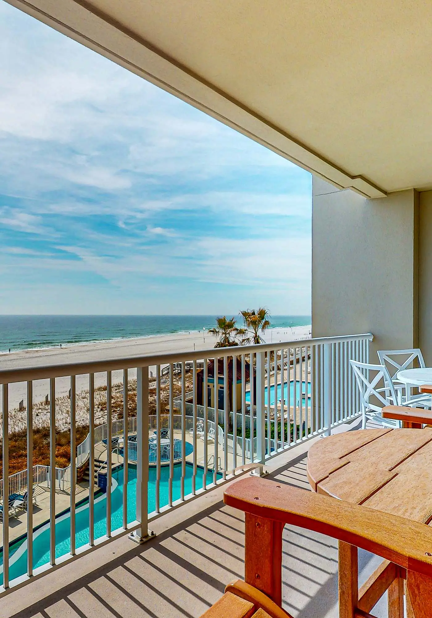 Spacious condo with Gulf-front views & access to pools, hot tub, gym