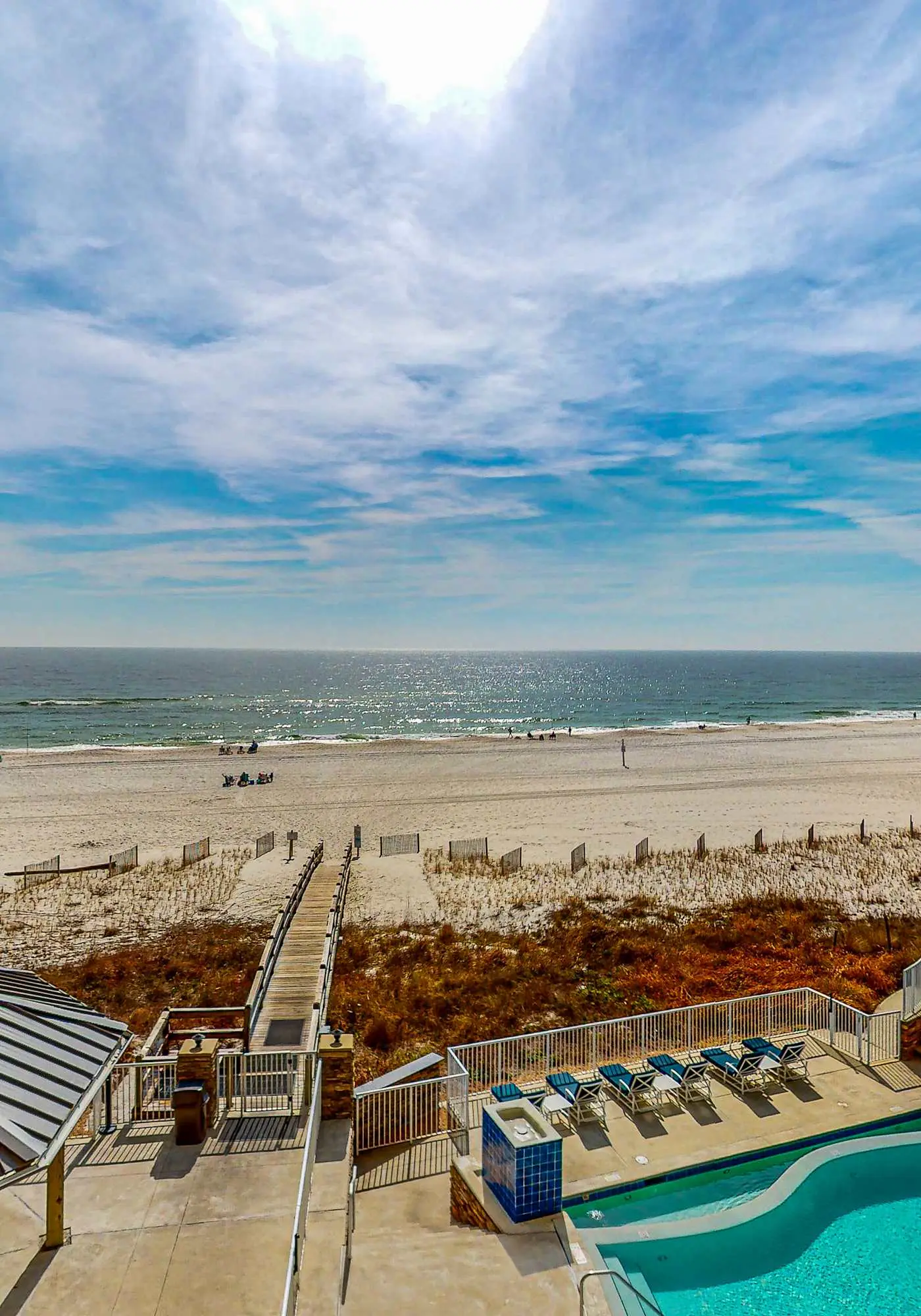 Spacious condo with Gulf-front views & access to pools, hot tub, gym
