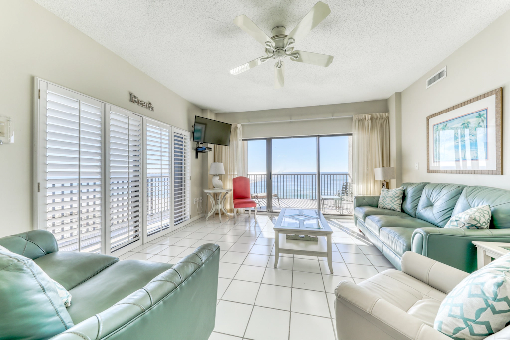 Waterfront corner condo with shared pools, wrap-around balcony, & tennis courts