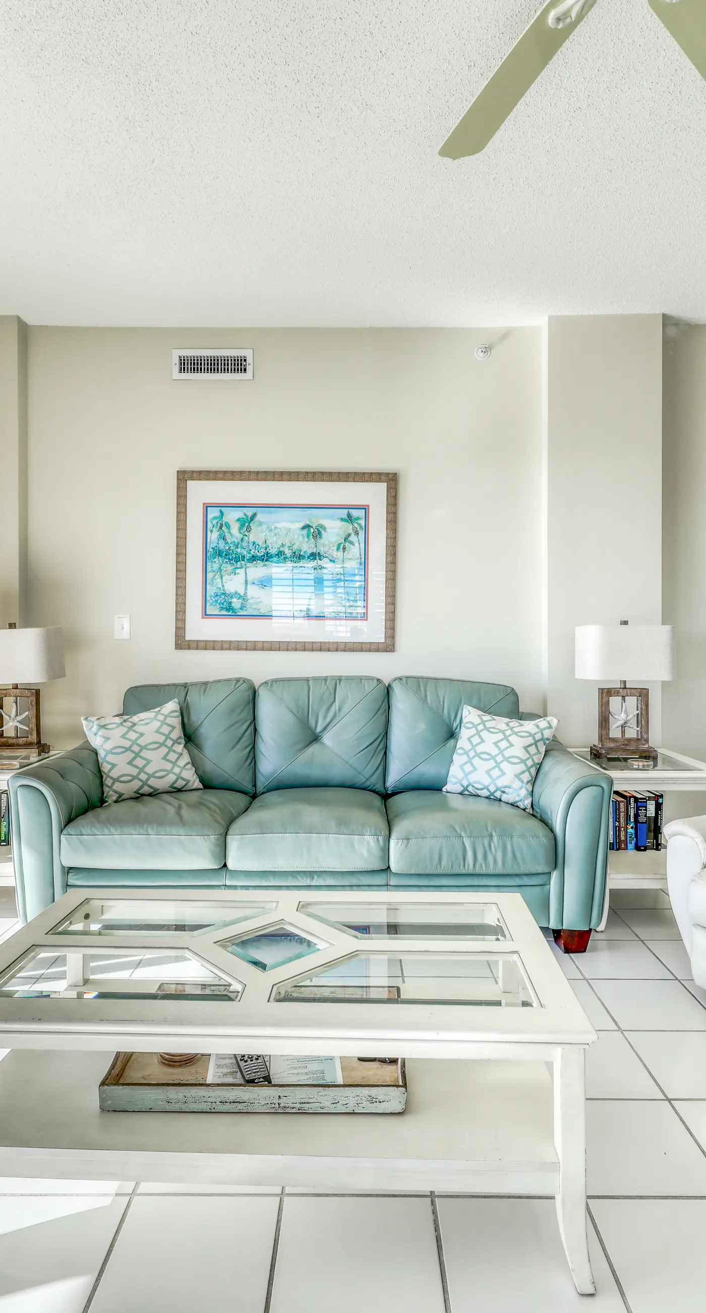 Waterfront corner condo with shared pools, wrap-around balcony, & tennis courts