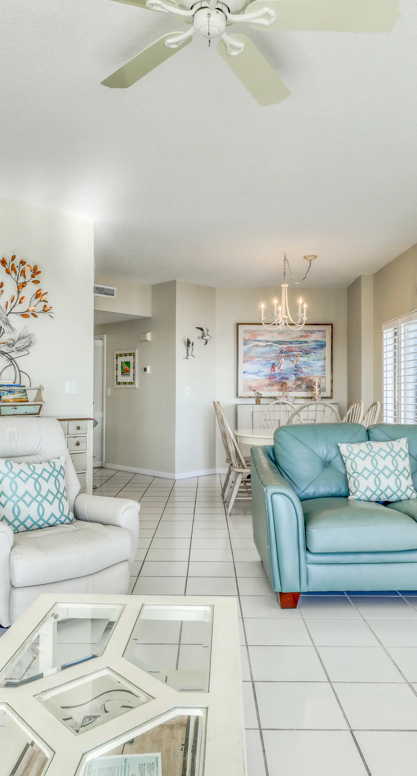 Waterfront corner condo with shared pools, wrap-around balcony, & tennis courts