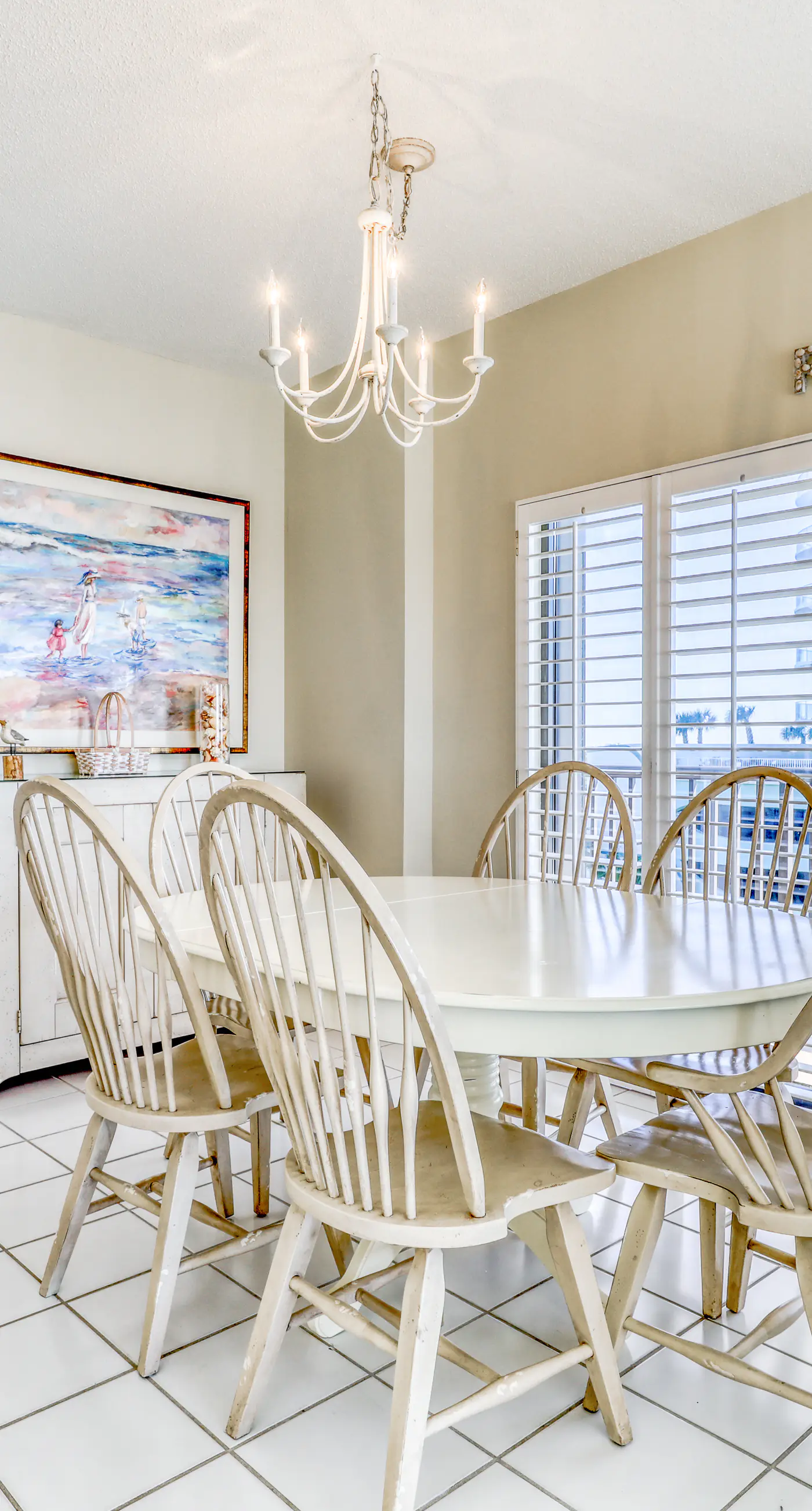 Waterfront corner condo with shared pools, wrap-around balcony, & tennis courts