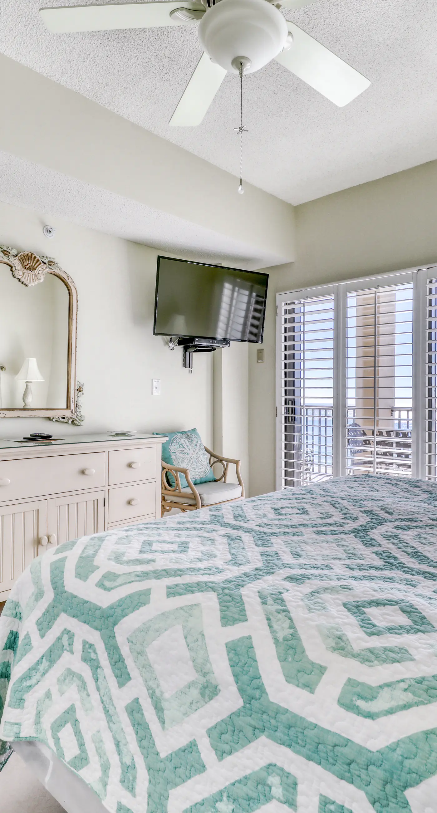 Waterfront corner condo with shared pools, wrap-around balcony, & tennis courts