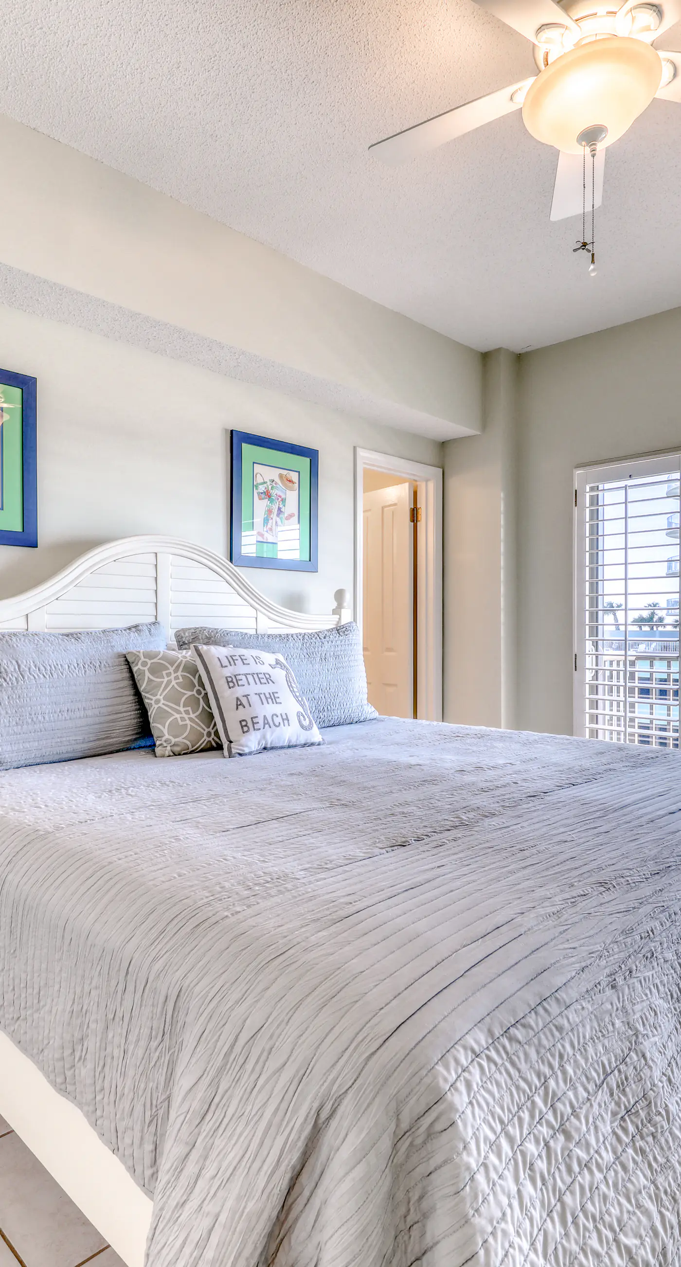 Waterfront corner condo with shared pools, wrap-around balcony, & tennis courts