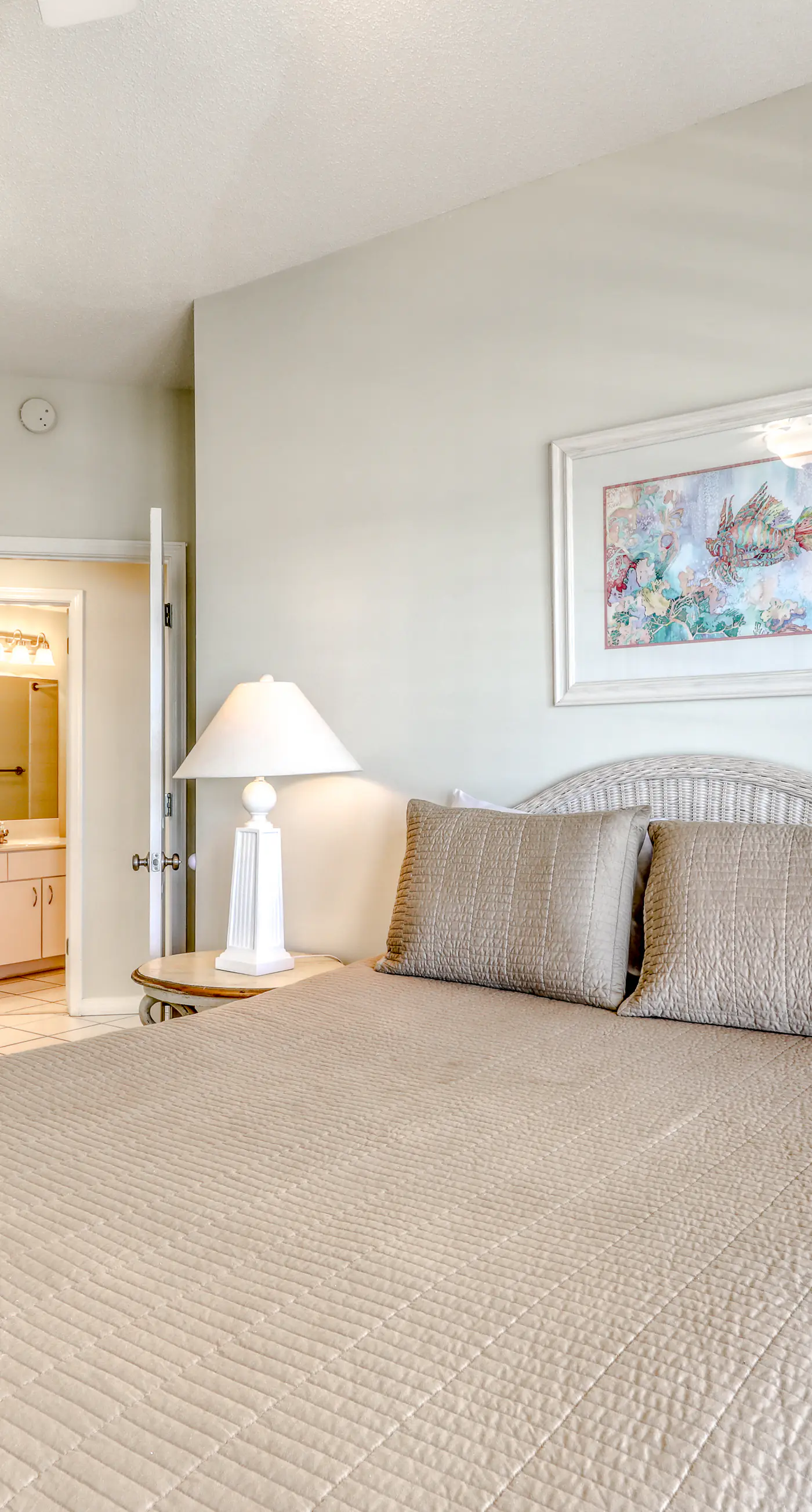 Waterfront corner condo with shared pools, wrap-around balcony, & tennis courts