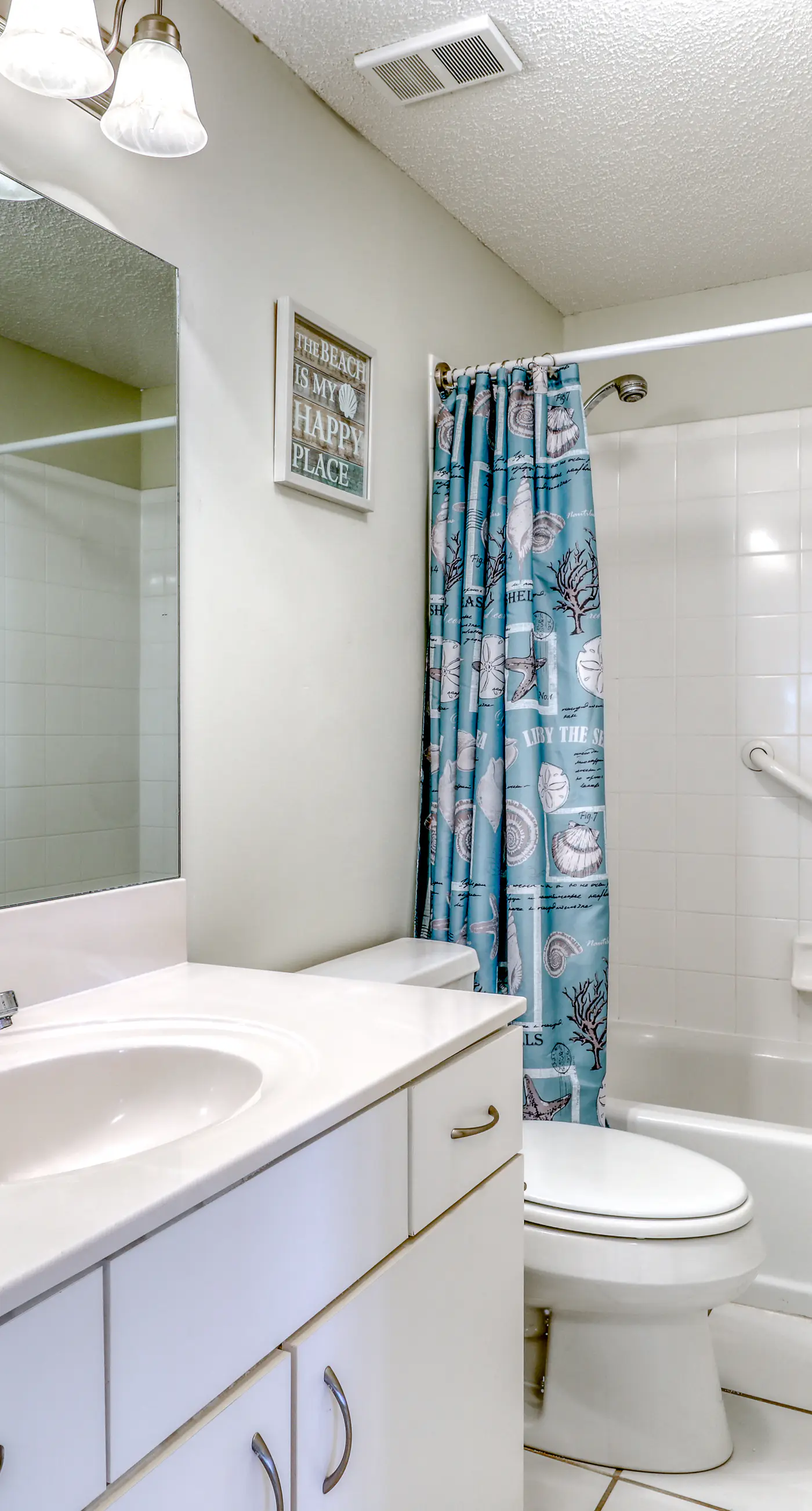 Waterfront corner condo with shared pools, wrap-around balcony, & tennis courts
