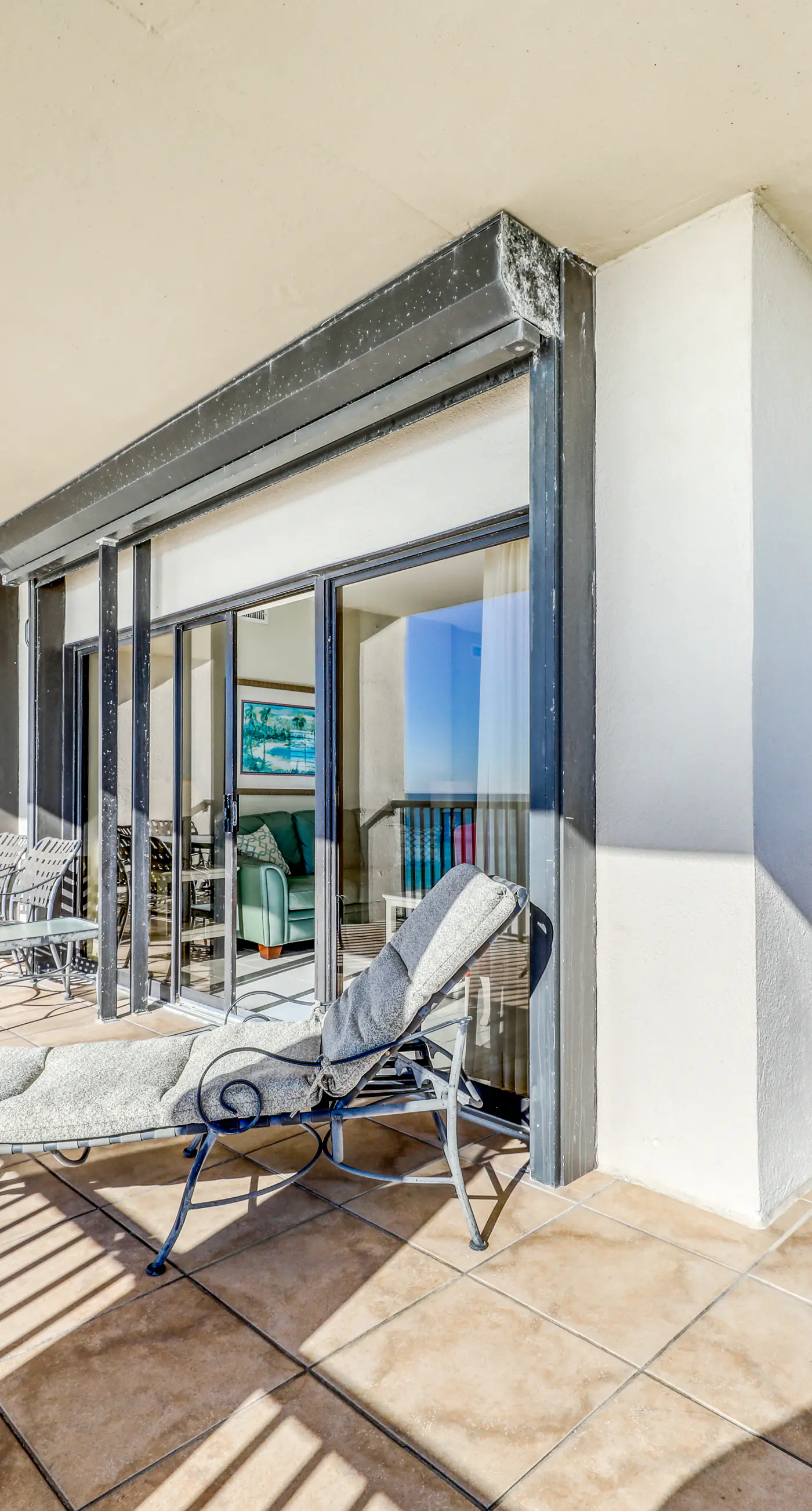 Waterfront corner condo with shared pools, wrap-around balcony, & tennis courts