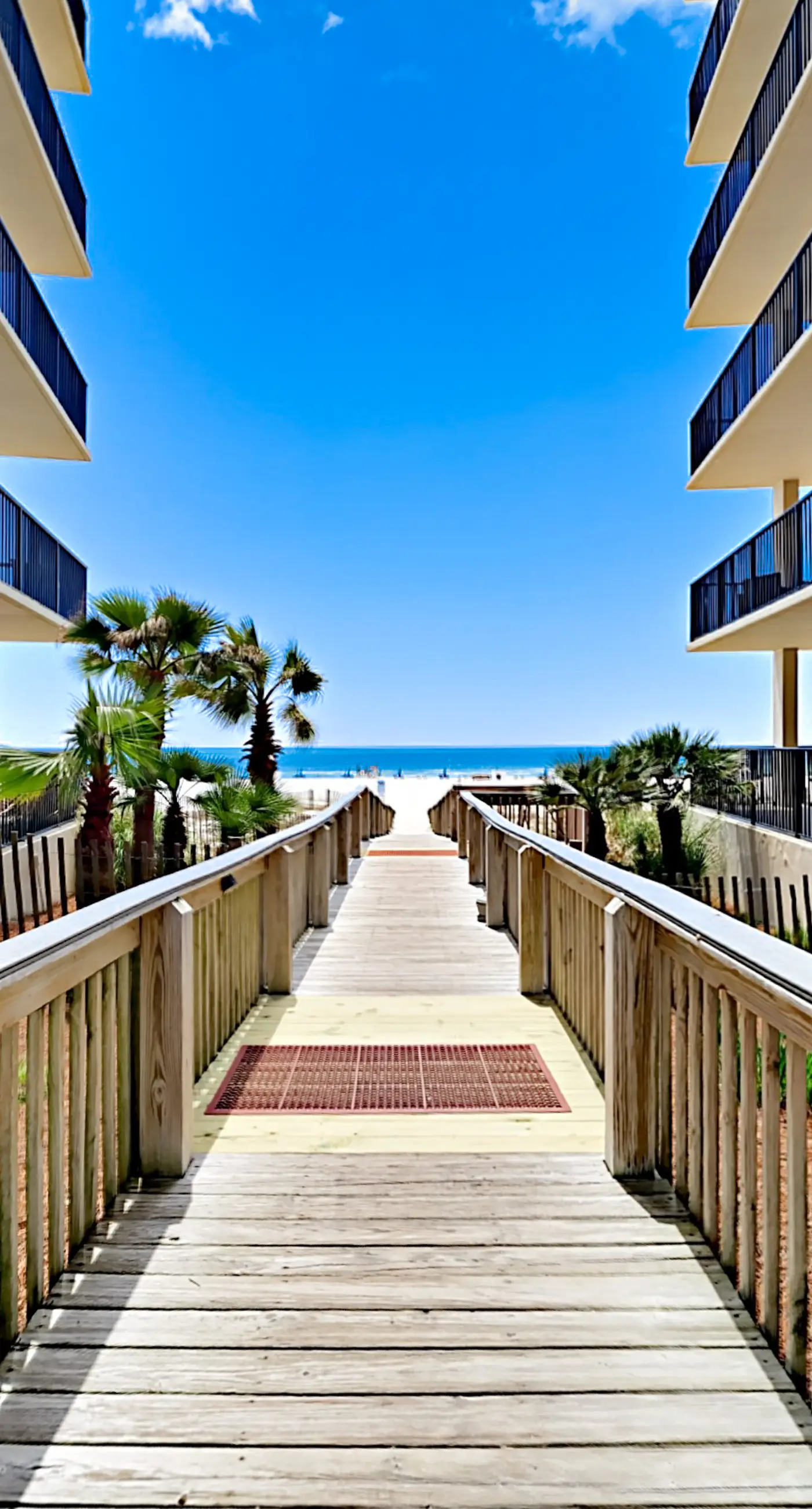 Waterfront corner condo with shared pools, wrap-around balcony, & tennis courts
