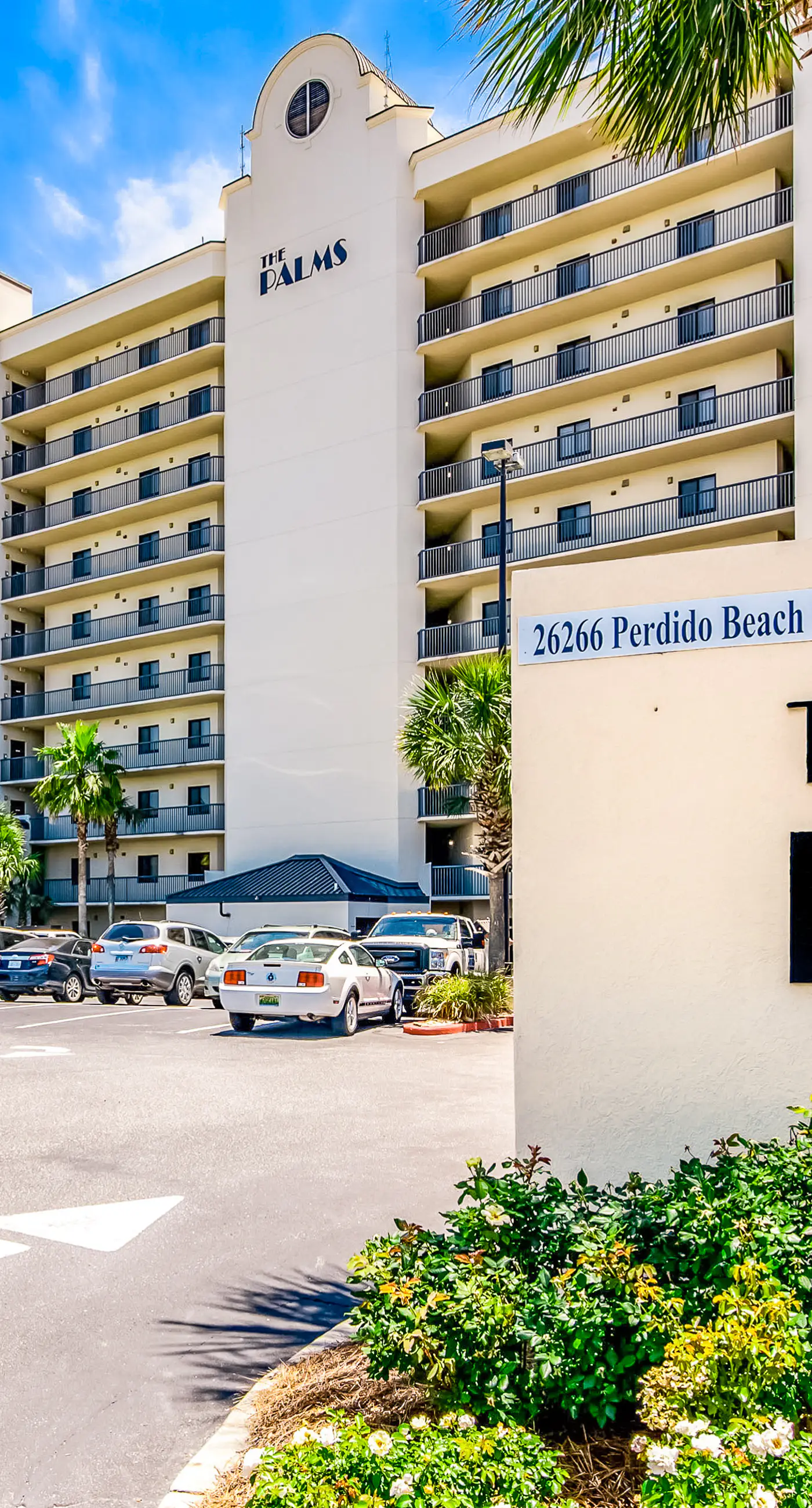 Waterfront corner condo with shared pools, wrap-around balcony, & tennis courts