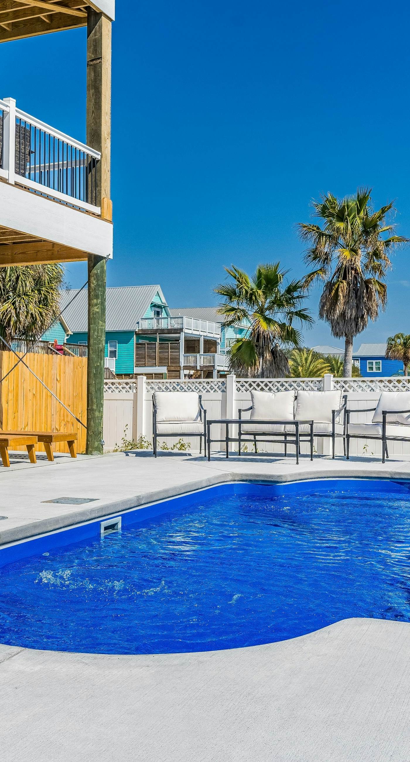 Dog-friendly home with water view, shared pool, grill & EV charger, walk to beach