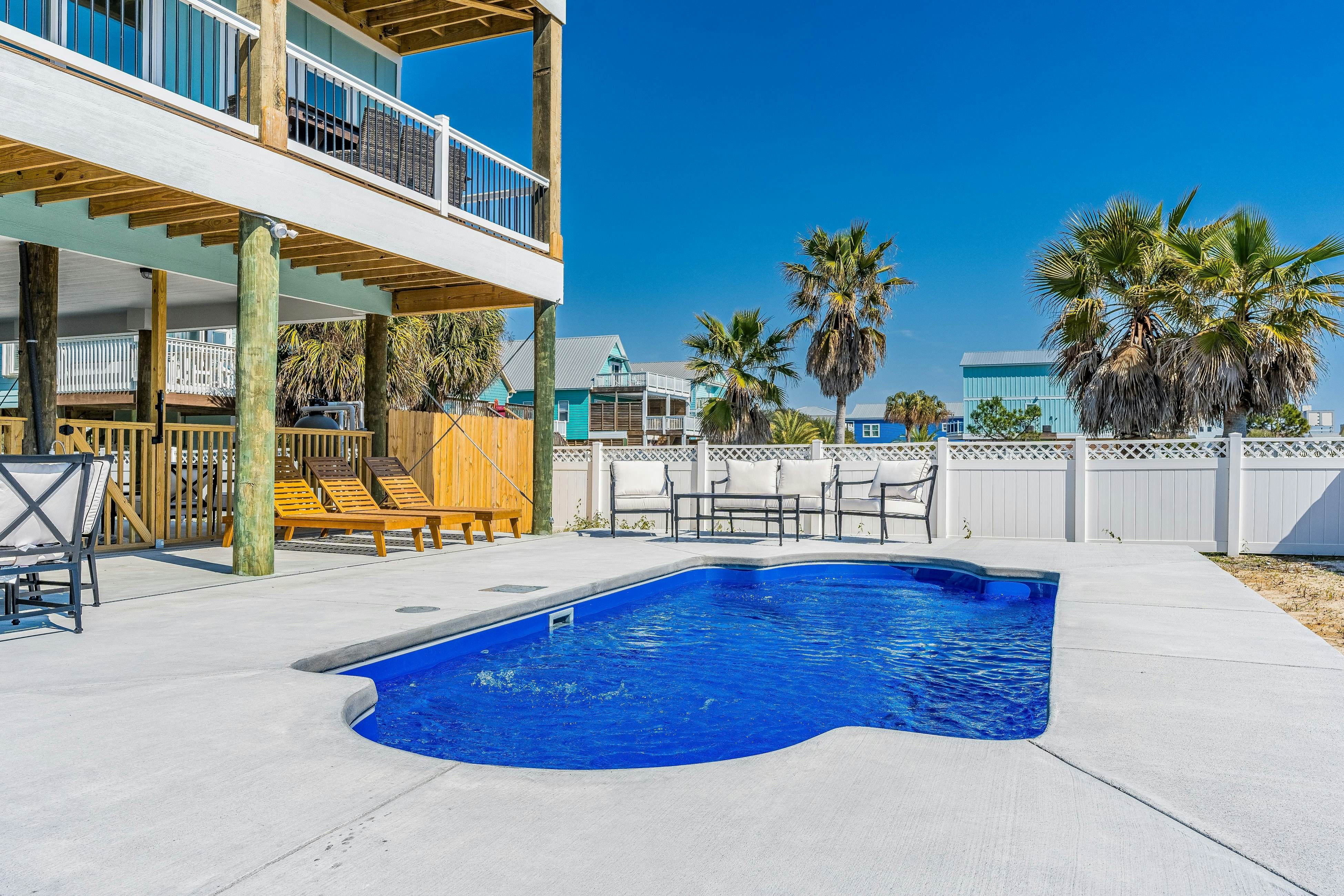 Dog friendly home with water views, shared pool, grill, & EV charger