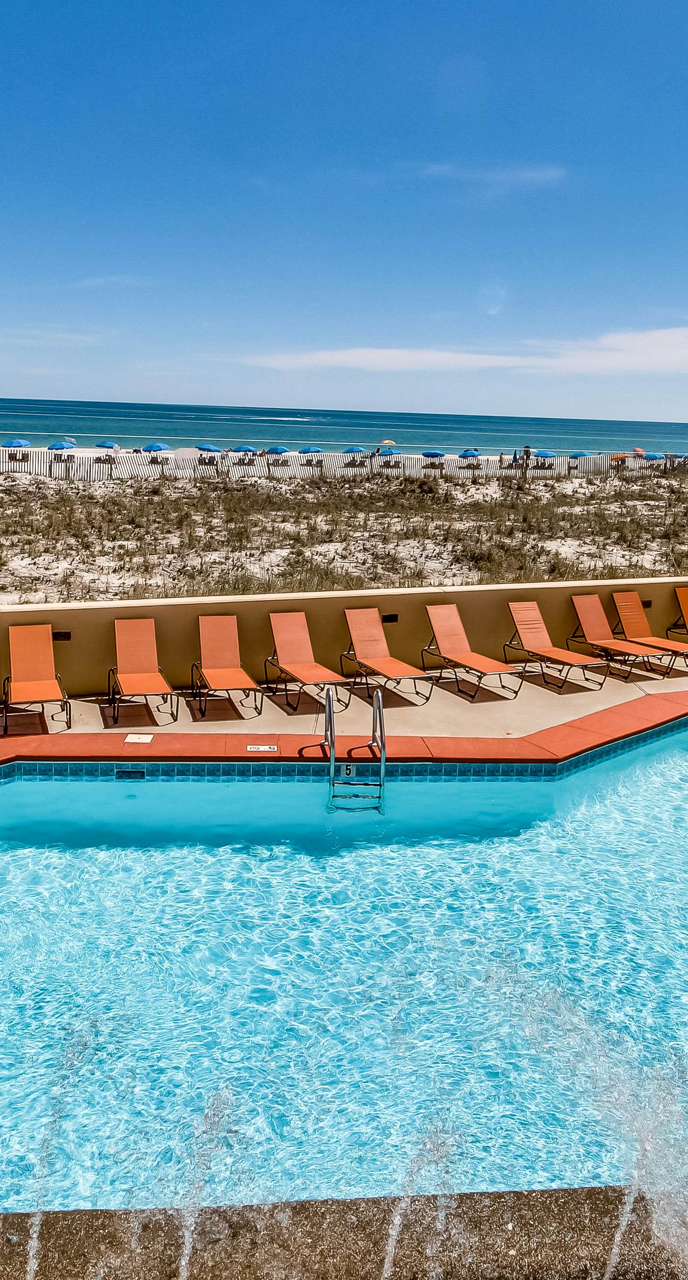 Casual beachfront getaway with pool, ocean views, & beach access