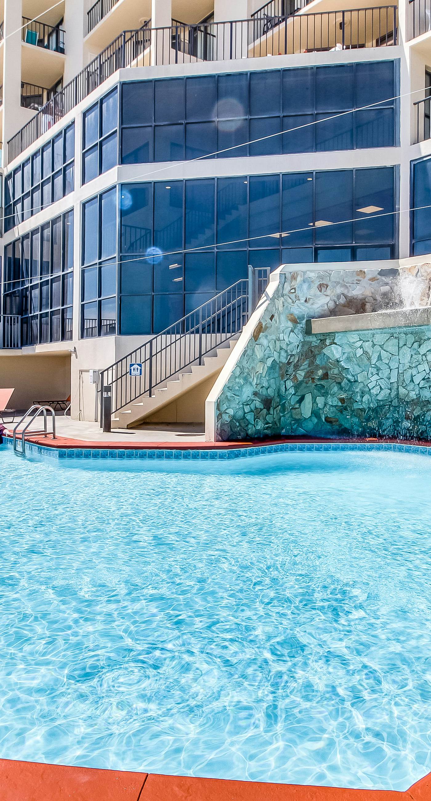 Casual beachfront getaway with pool, ocean views, & beach access