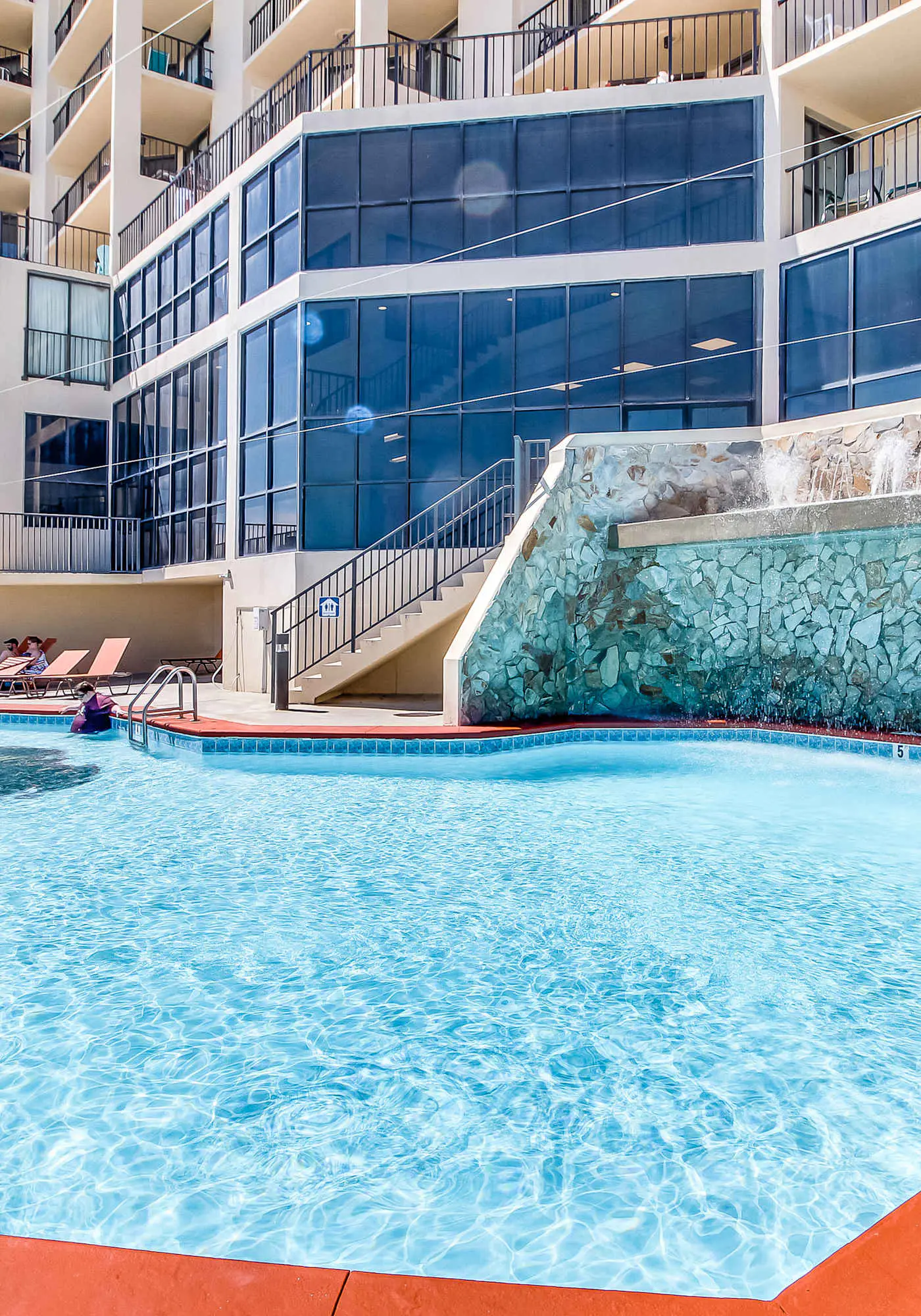 Casual beachfront getaway with pool, ocean views, & beach access
