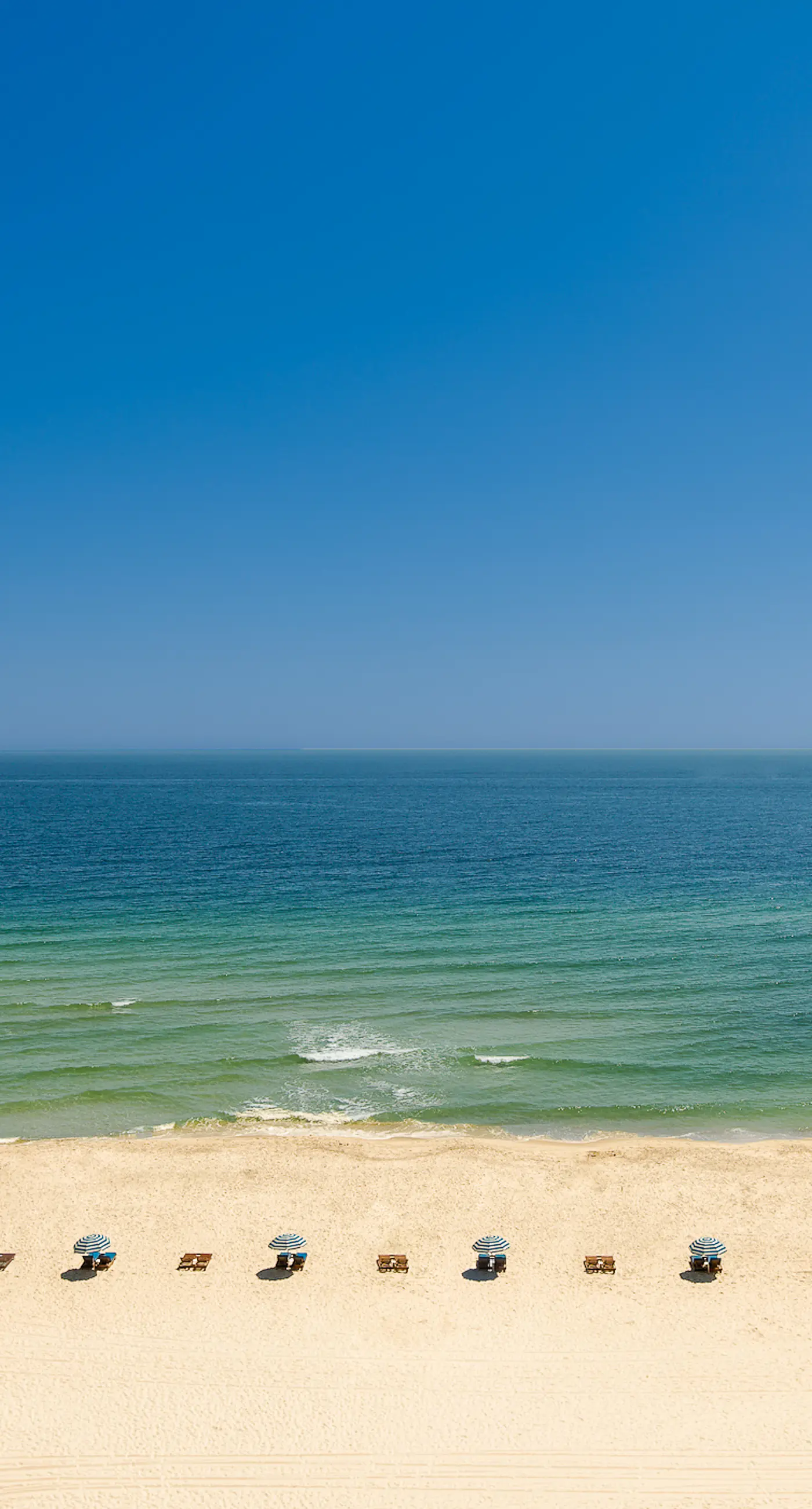 Family-friendly, Gulf-front condo with private balcony and resort style pools, sauna and gym