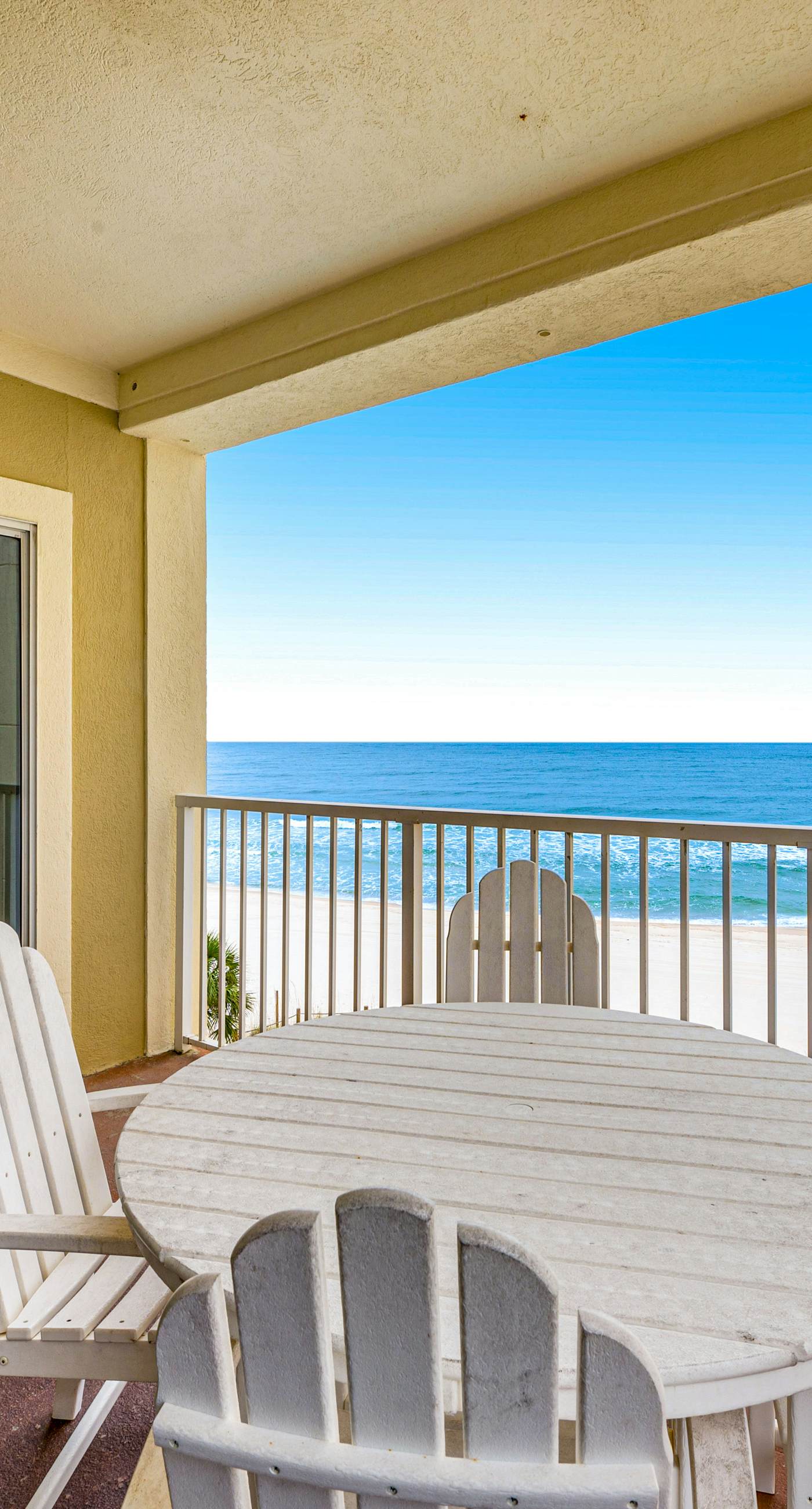 Beachfront condo with Gulf front shared pool, private balcony, and grilling area