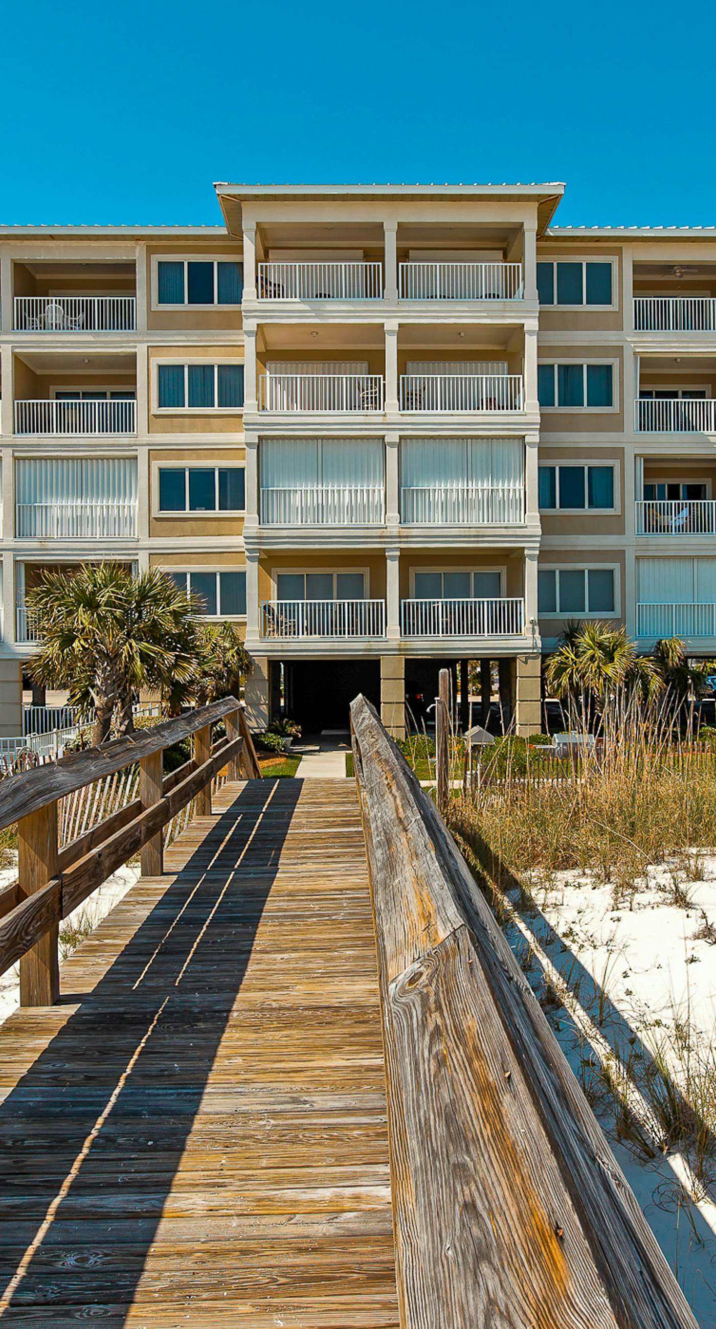 Beachfront condo with Gulf front shared pool, private balcony, and grilling area