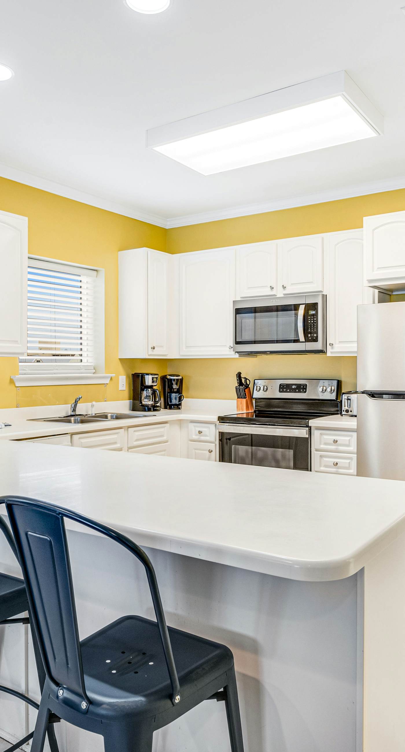 Beachfront condo with Gulf front shared pool, private balcony, and grilling area