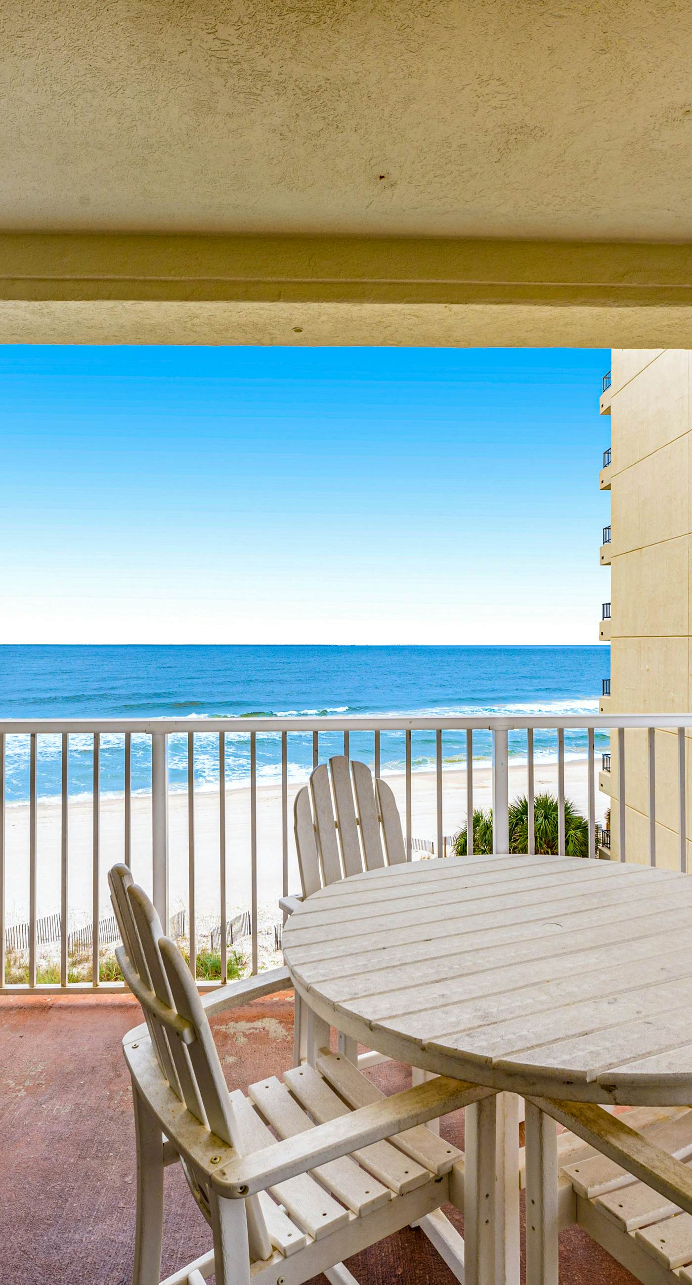 Beachfront condo with Gulf front shared pool, private balcony, and grilling area