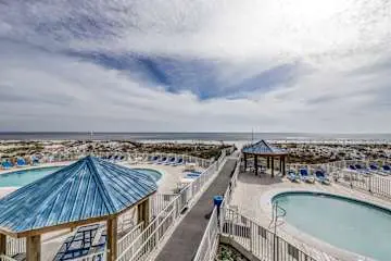 Inviting condo w/ a spacious living area, shared pools, & easy beach access
