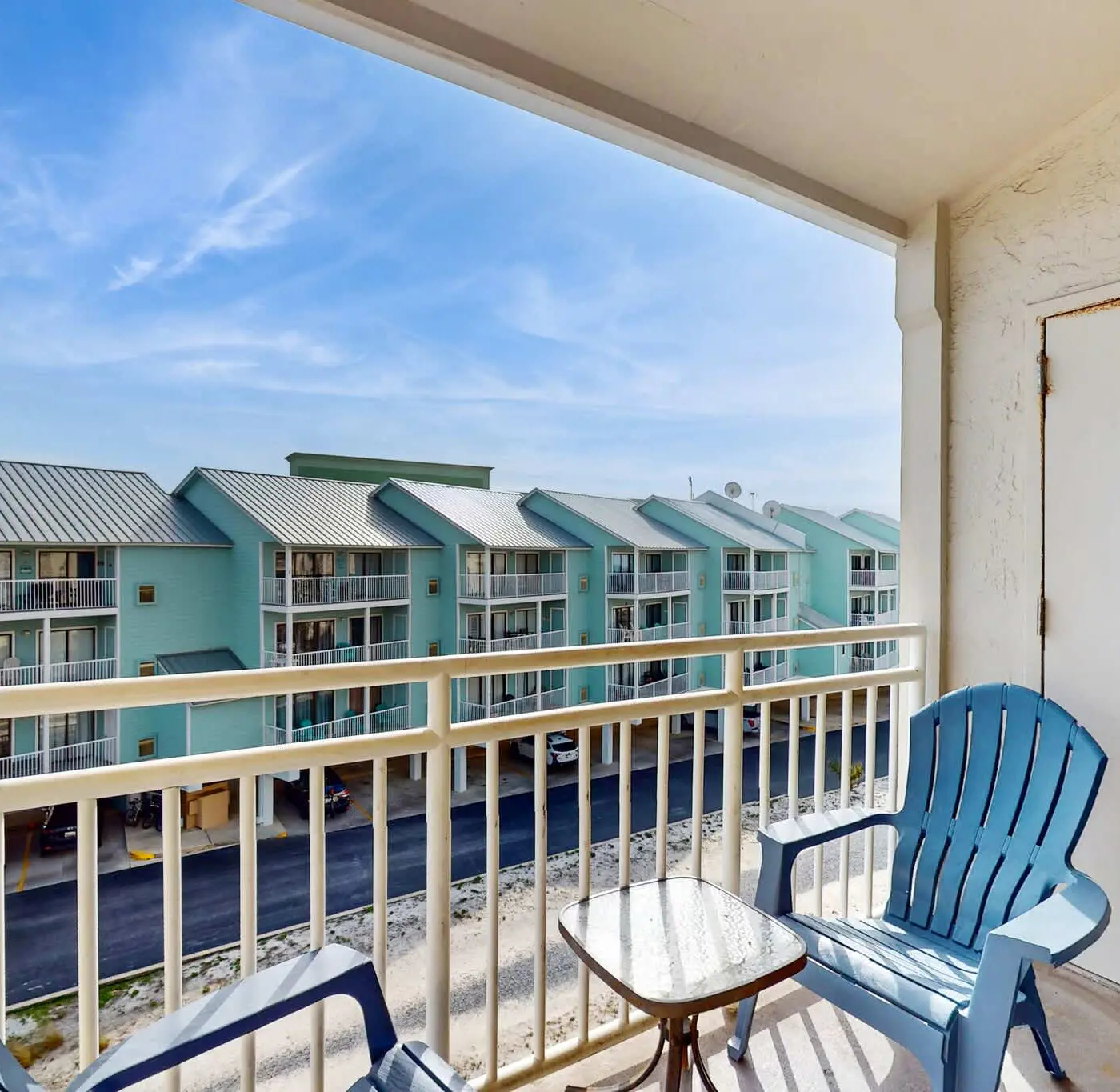 Gulf view condo with a full kitchen, private balcony, shared pools, & tennis court