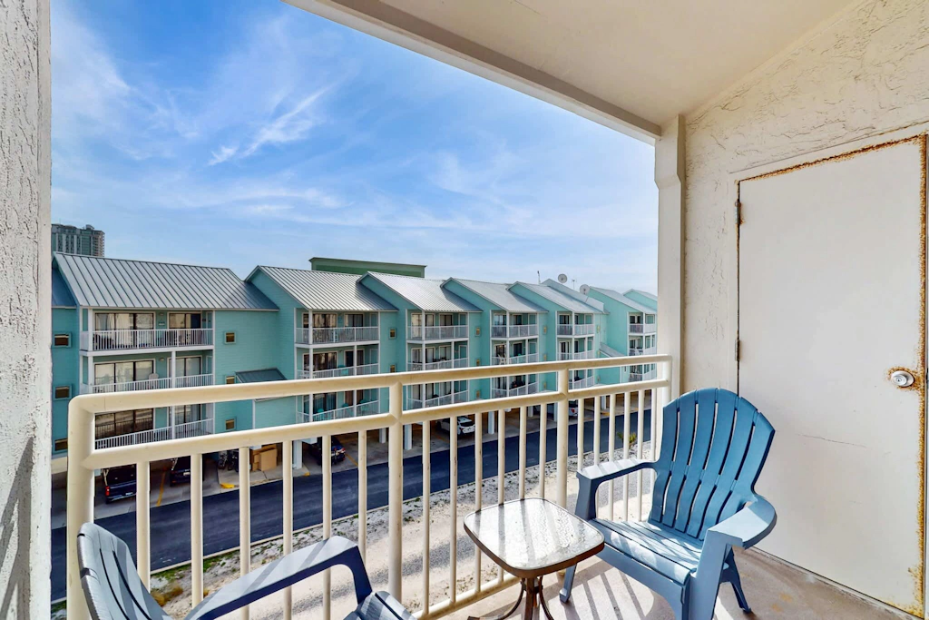 Gulf view condo with a full kitchen, private balcony, shared pools, & tennis court