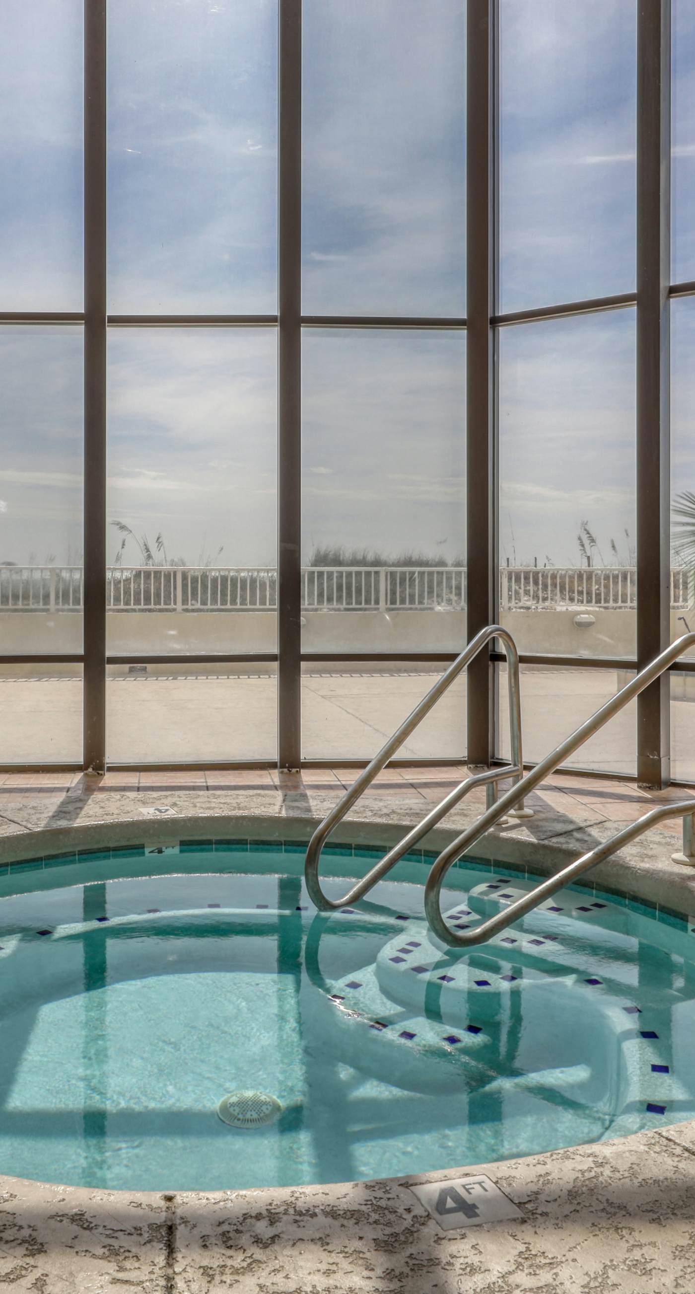 Waterfront condo w/ an open dining & living area, private balcony, shared pools