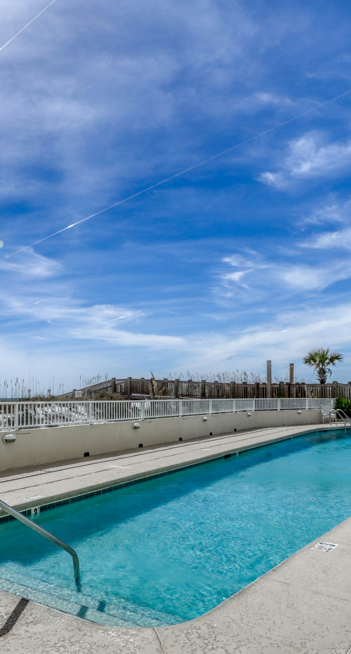 Waterfront condo w/ an open dining & living area, private balcony, shared pools