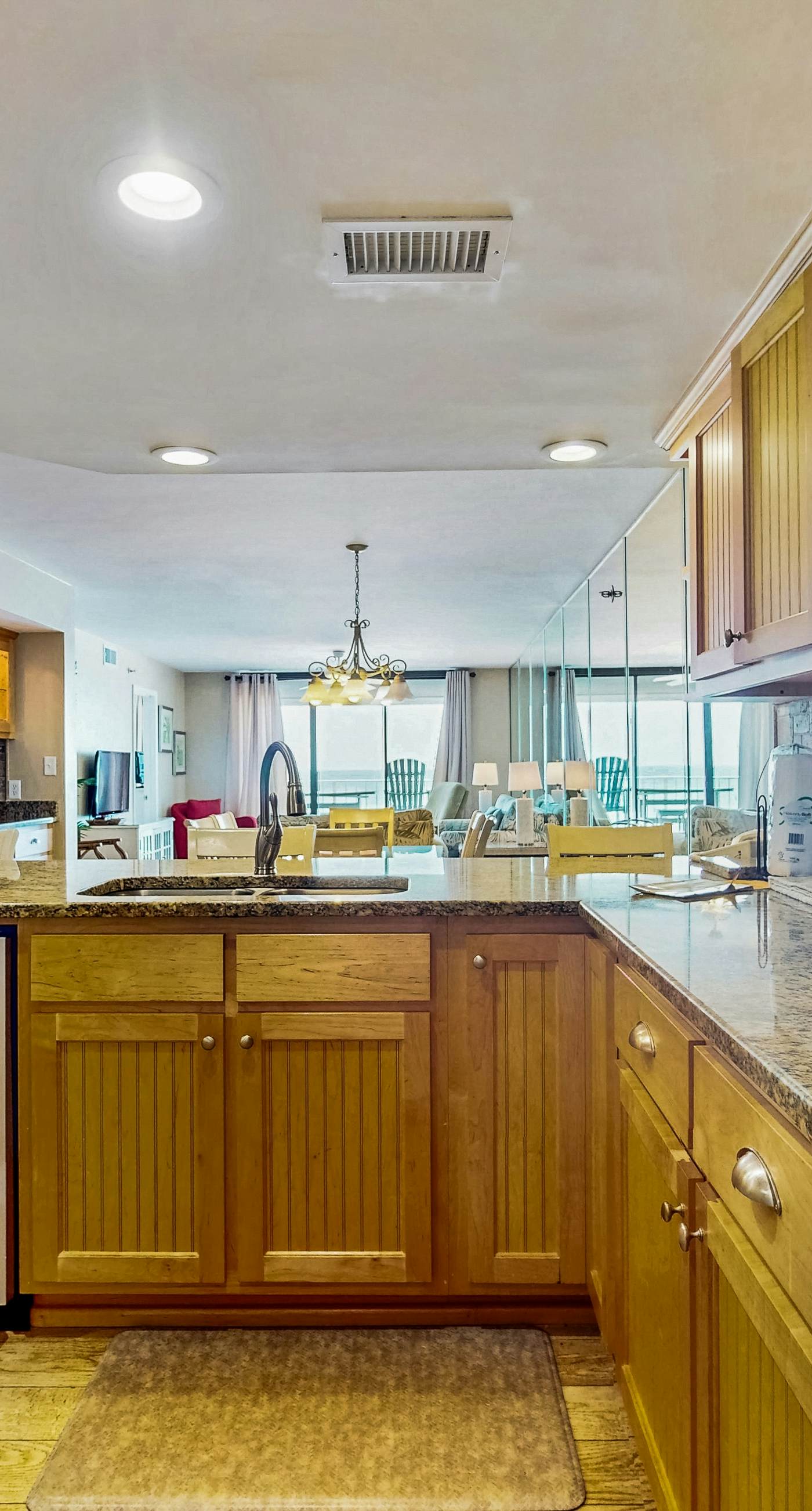 Waterfront condo w/ an open dining & living area, private balcony, shared pools